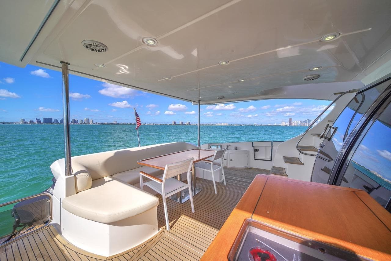 Luxurious 2012 Azimut Flybridge yacht deck with ocean view and seating area.