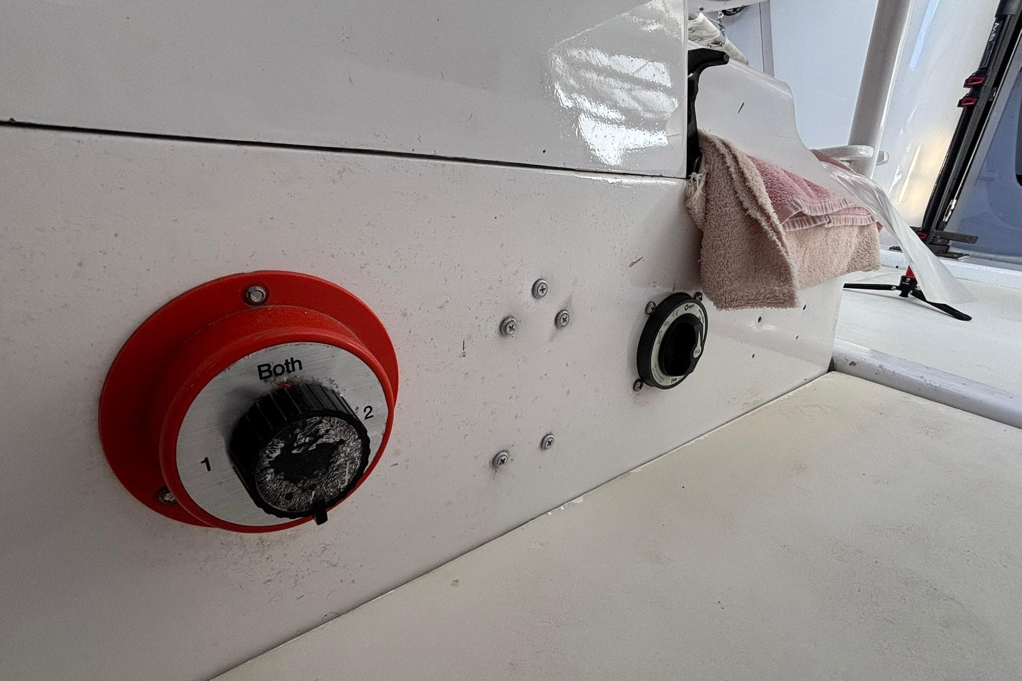 Control panel on a 1993 Nelson Marek 43 sailboat, featuring a red switch.