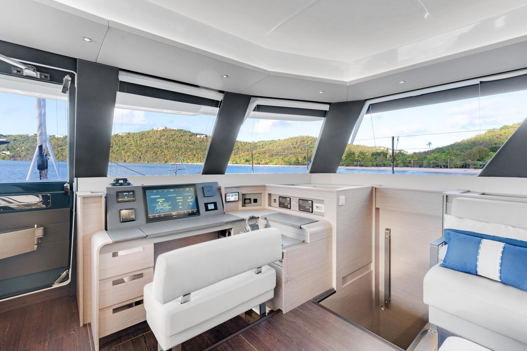 Luxurious interior of 2023 Fountaine Pajot Alegria yacht with modern navigation controls.