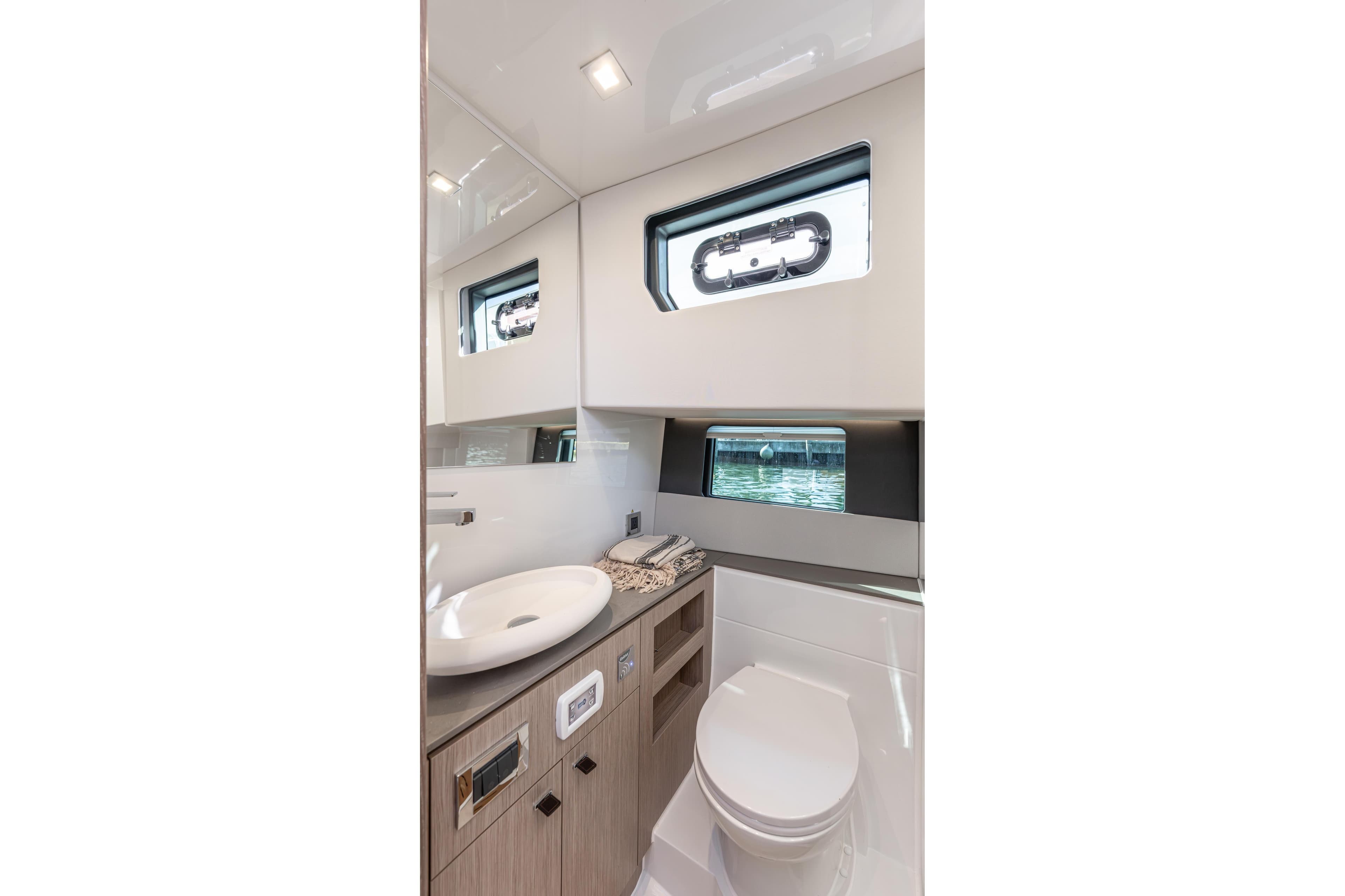 Luxurious bathroom interior of 2026 Fjord 41 XP yacht with modern fixtures.