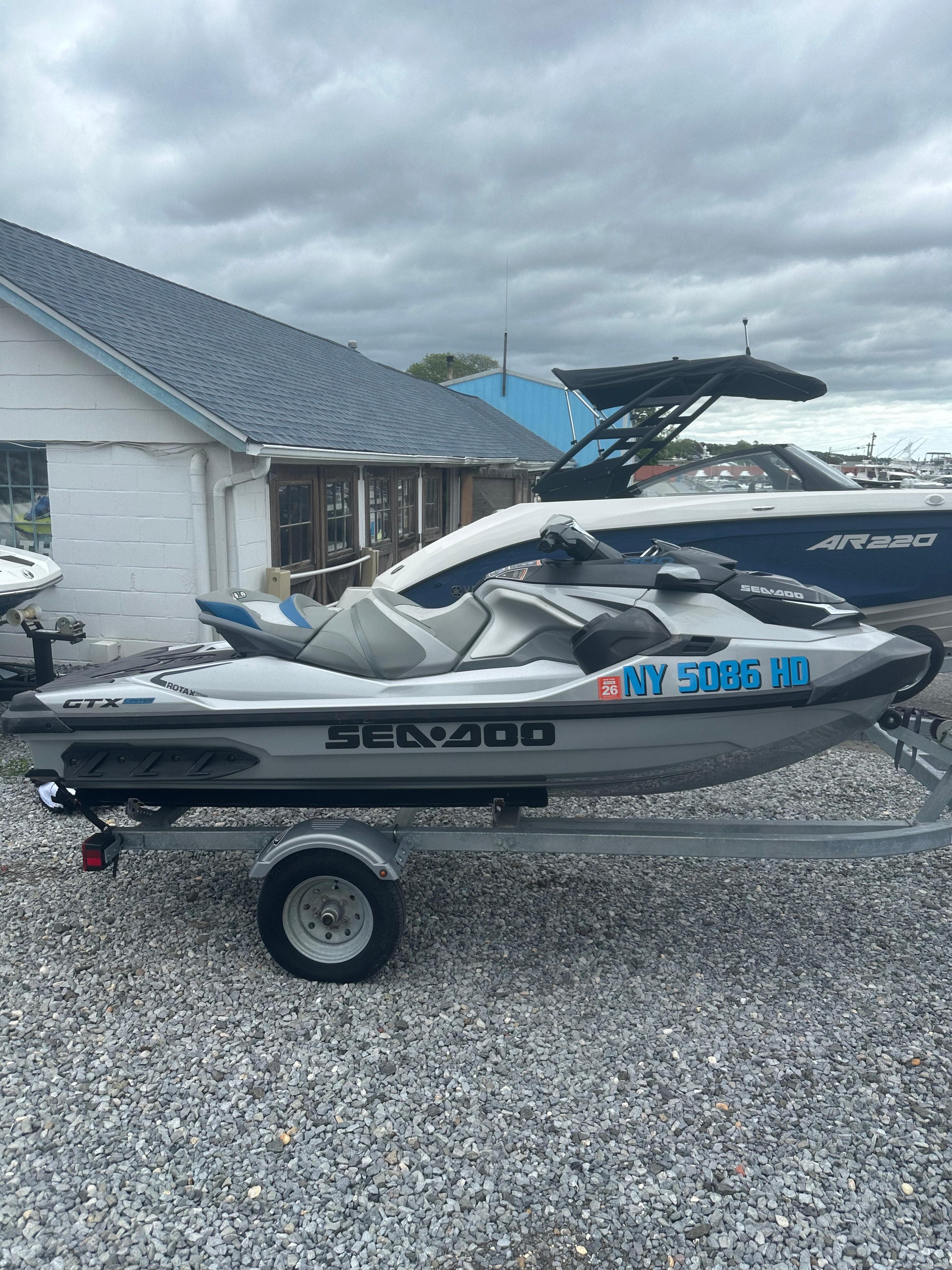 2020 Sea-Doo GTX Limited 300 on trailer, parked outdoors on gravel.