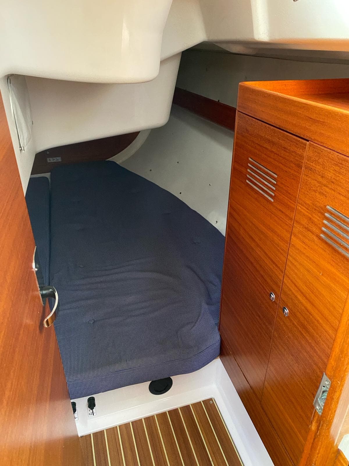 Interior of a 2009 X-Yachts X-34 with wooden furnishings.
