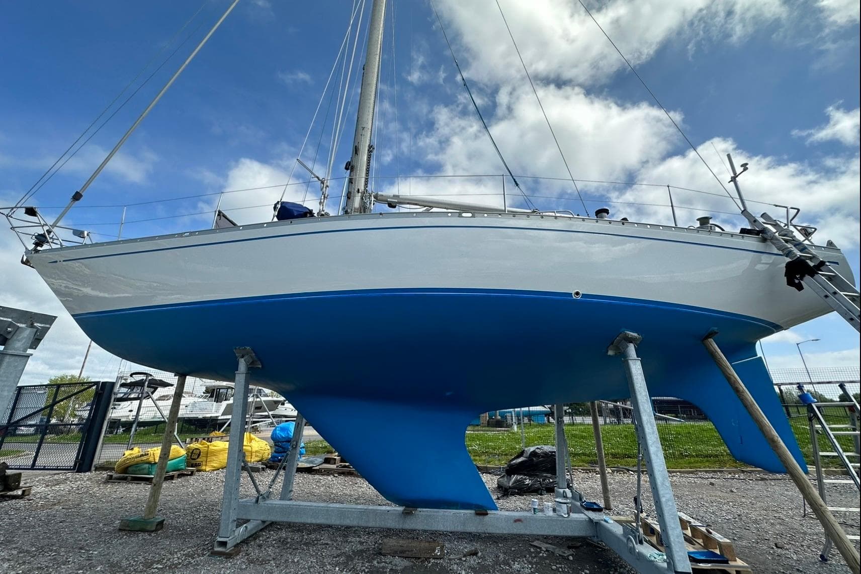 1974 Nautor Swan 41 sailboat on dry dock, showcasing blue hull and sleek design.