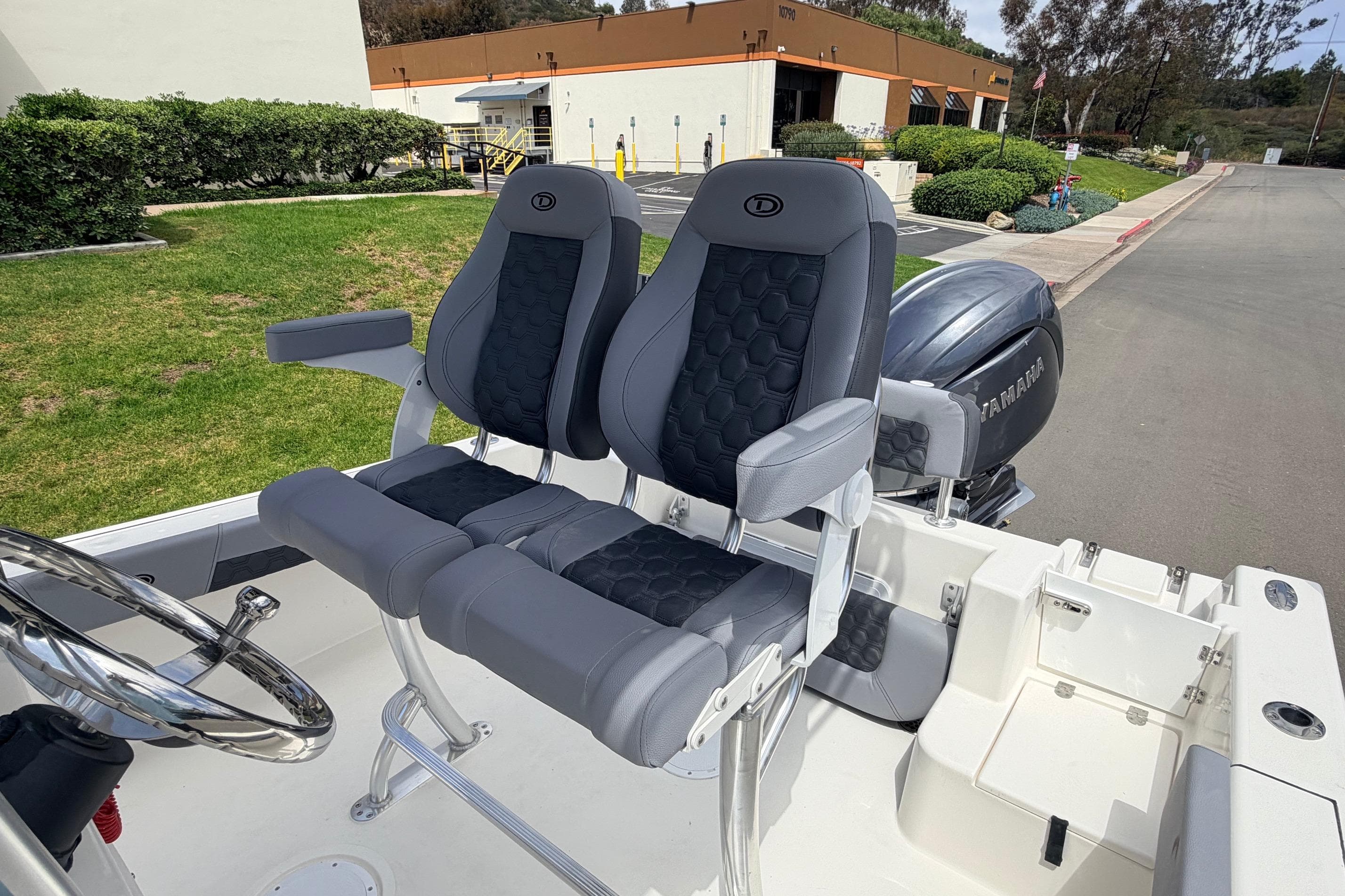 2026 Defiance Catalina 210 boat interior with dual seats and Yamaha engine.