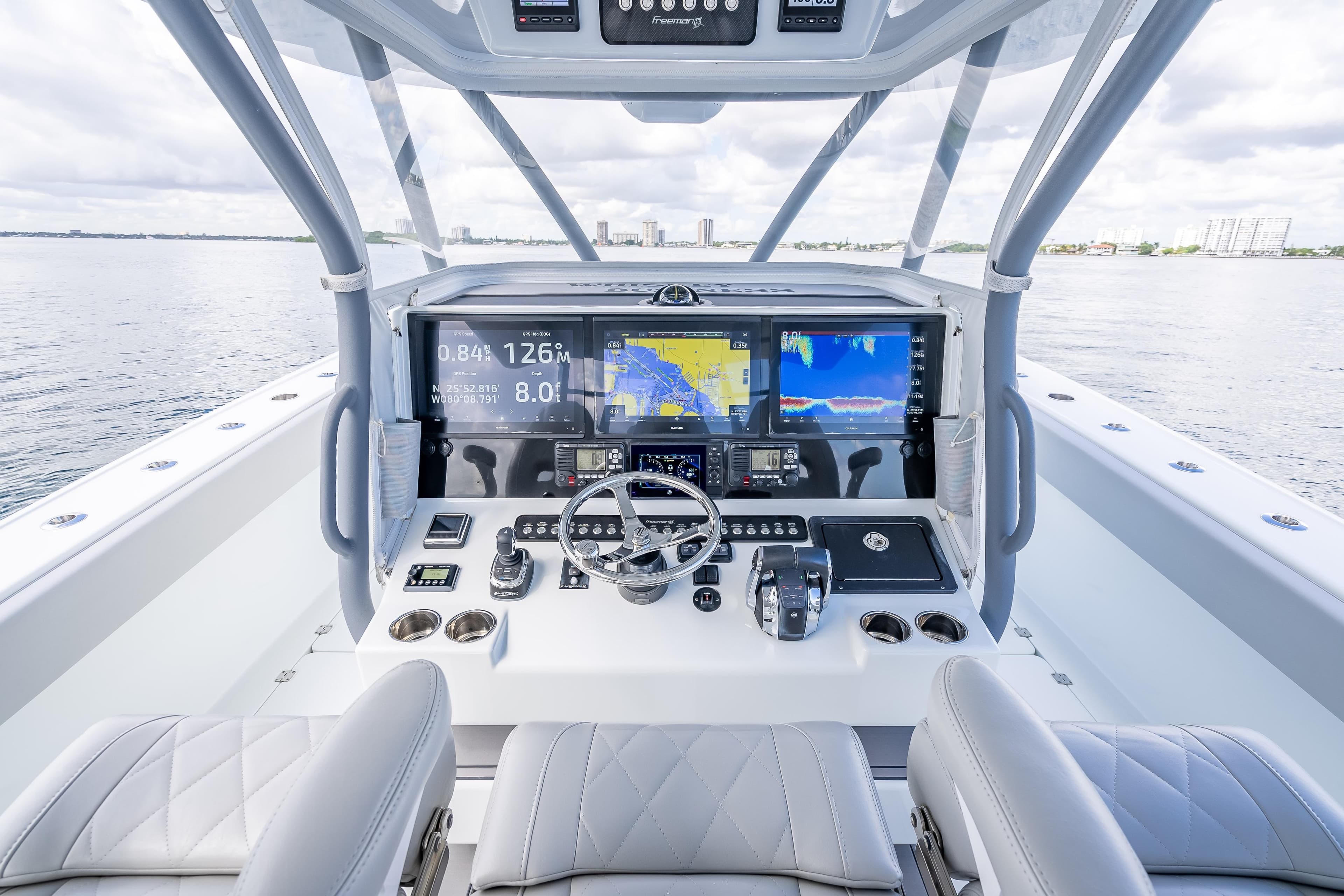 Modern helm of 2020 Freeman 42LR boat with advanced navigation displays and controls.