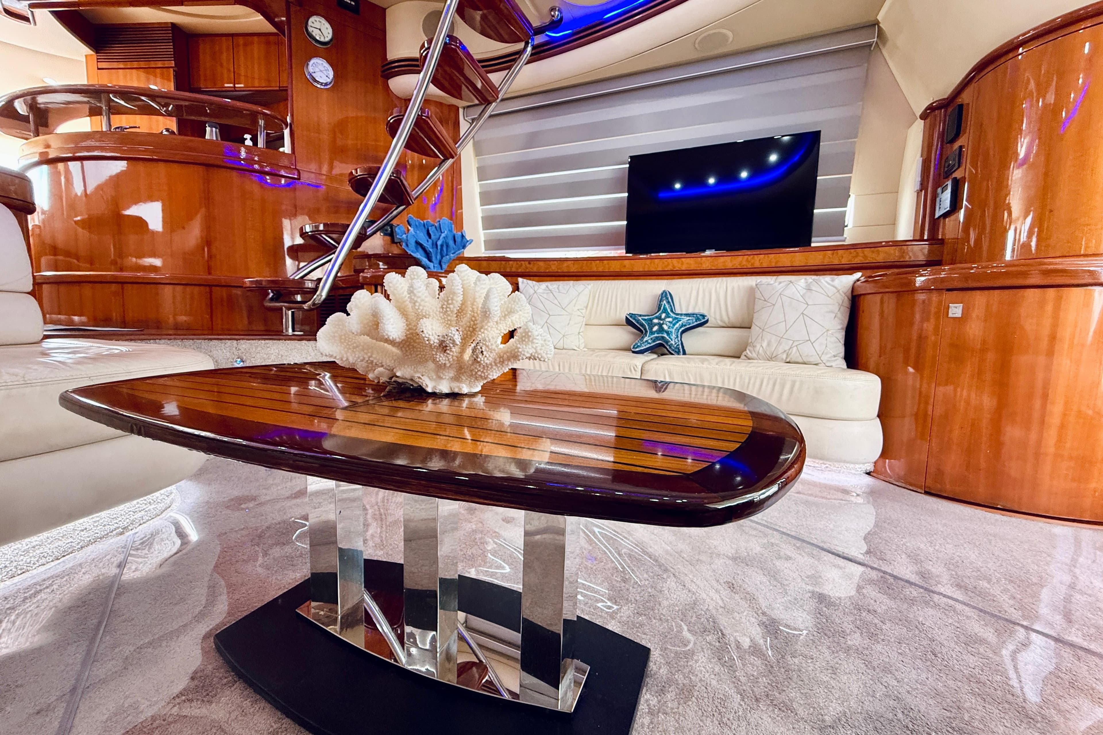 Luxurious interior of 2007 Azimut 68E yacht with elegant wood finishes and modern decor.