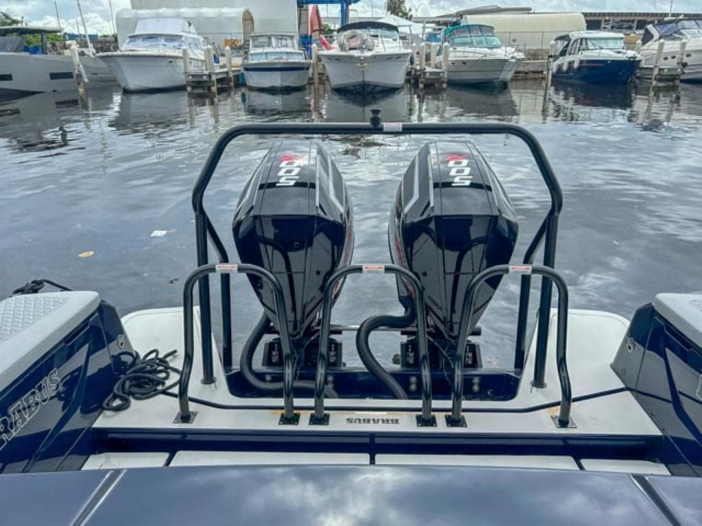 2024 BRABUS Shadow 1000 ST boat with twin outboard engines docked at marina.