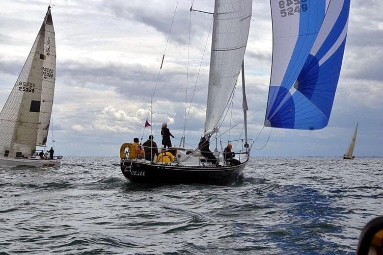 Sailboats racing on open water, featuring a 1972 C&C 39 model.