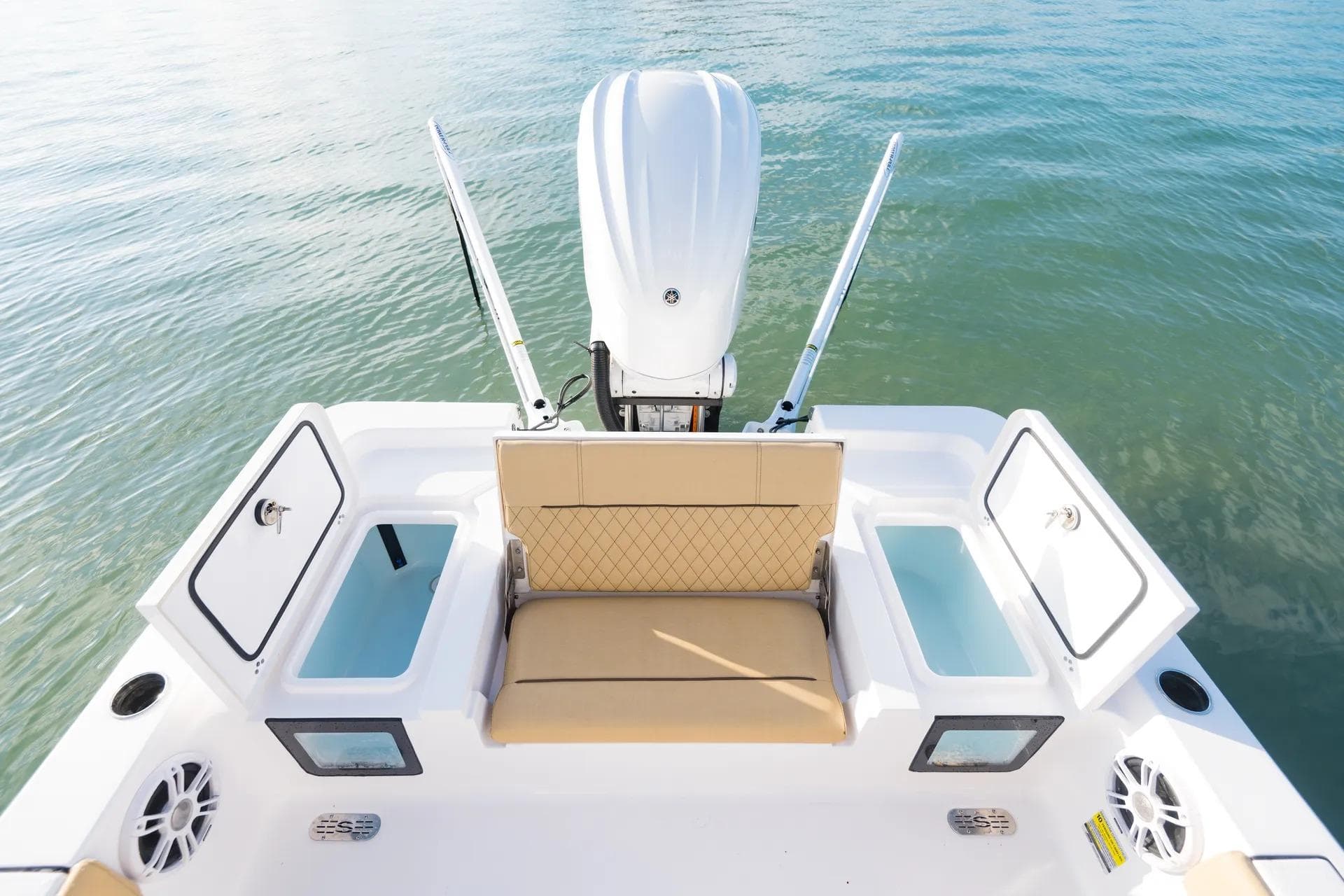 2026 Sportsman Masters 247 Bay Boat with tan seating and open storage compartments.