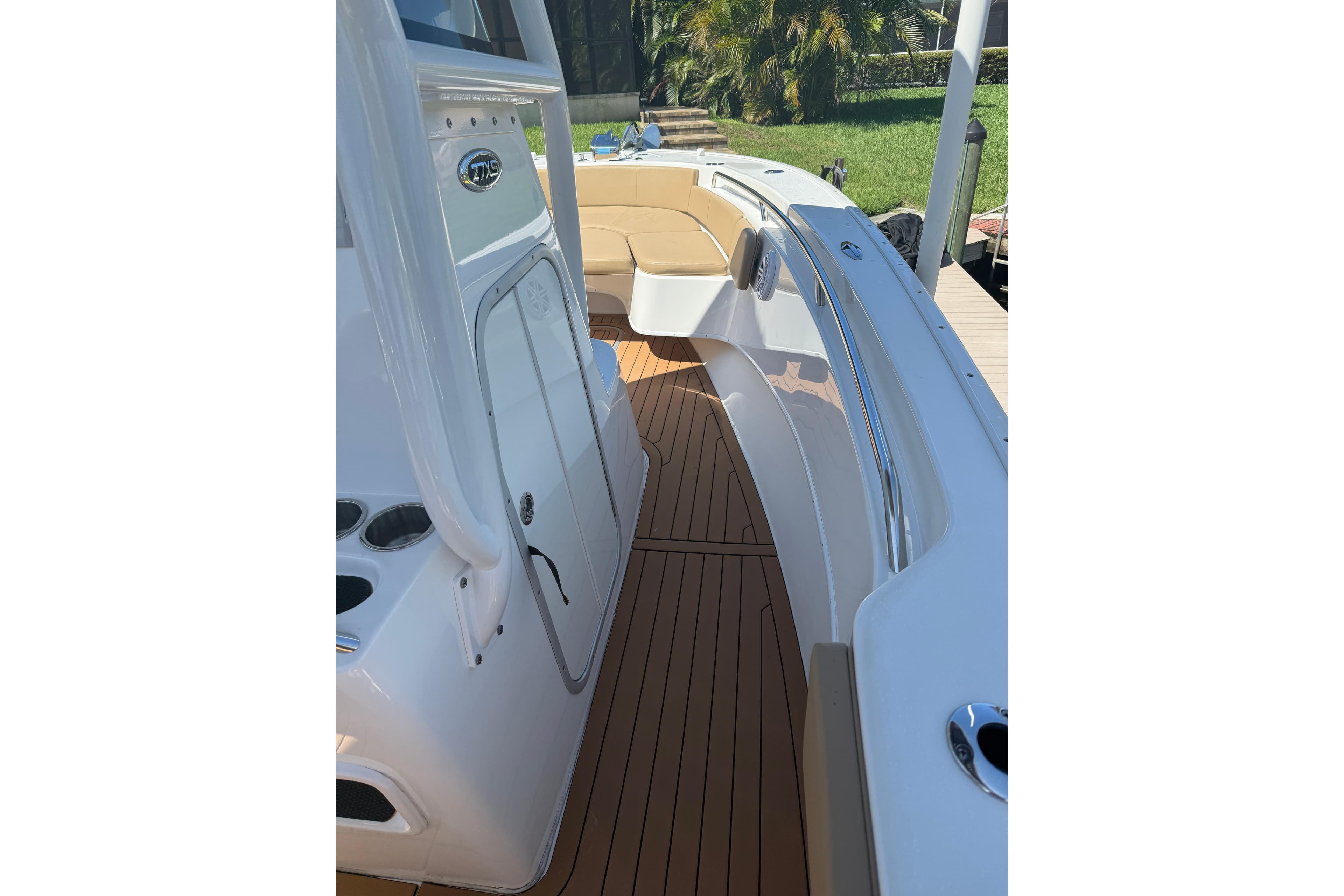 2019 Cape Horn 27XS boat interior with teak flooring and seating area.