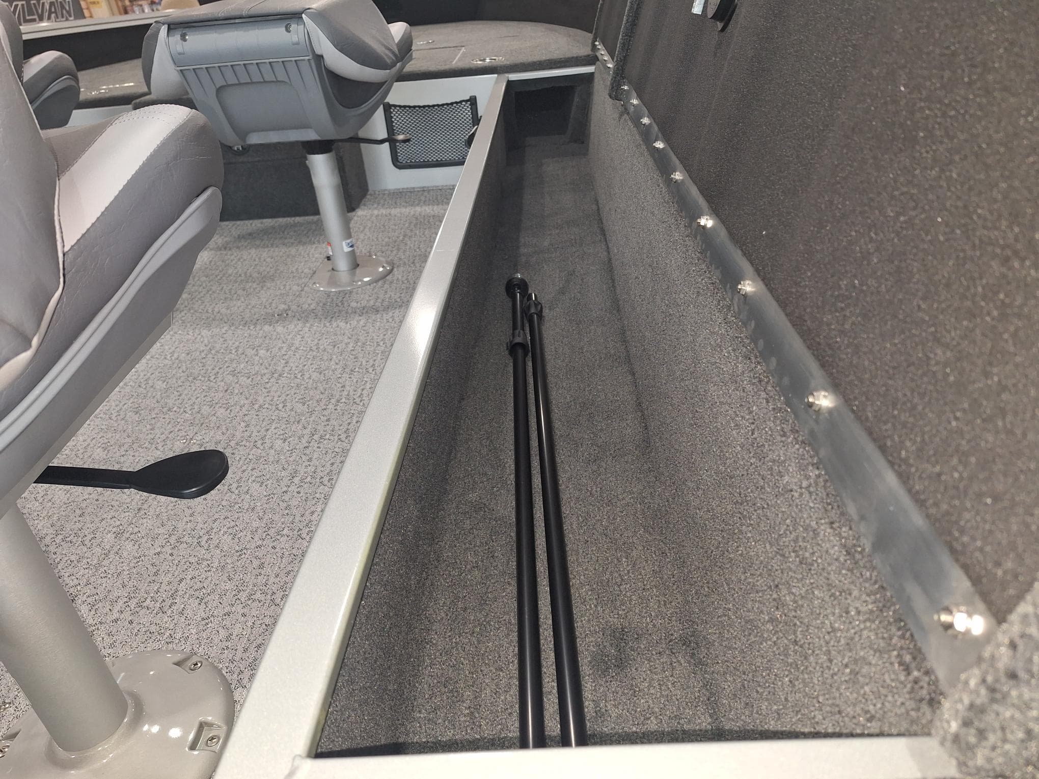 2025 Starcraft Delta 188 T boat interior with seating and storage compartment.