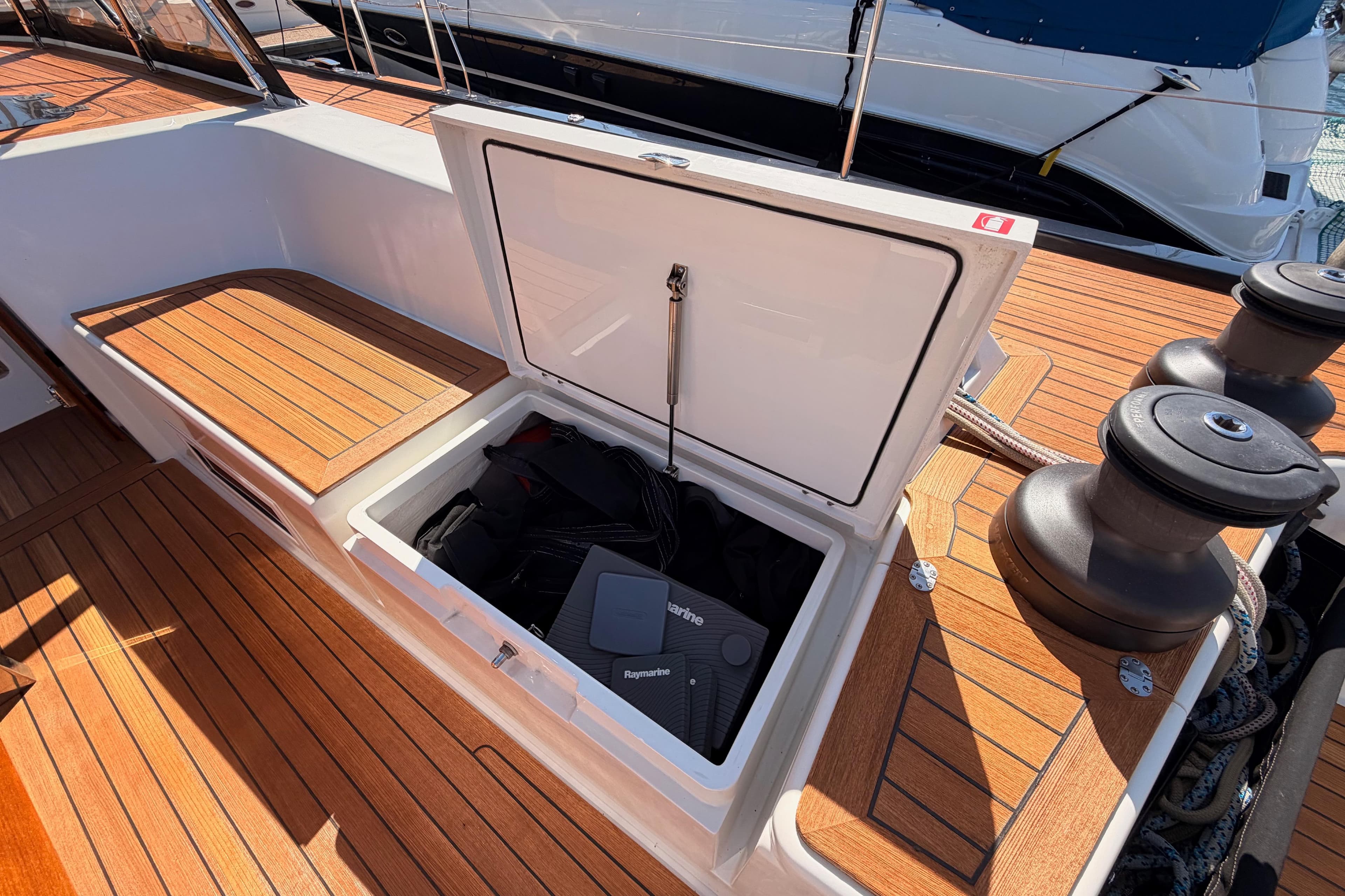 Open storage compartment on 2017 Solaris 50 yacht deck with Raymarine equipment.