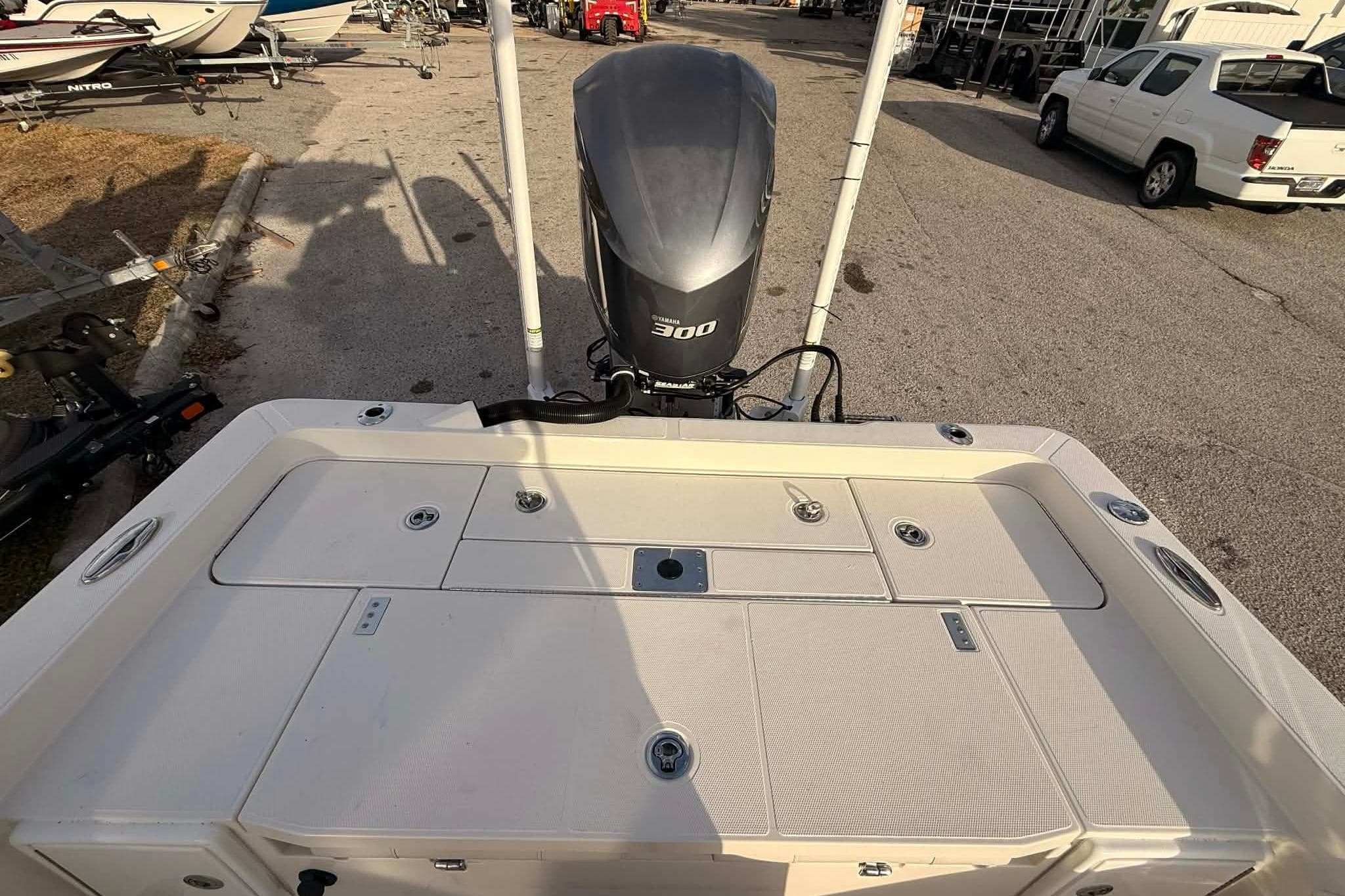 2019 Ranger 2510 Bay Ranger boat with powerful 300 horsepower engine, parked outdoors.
