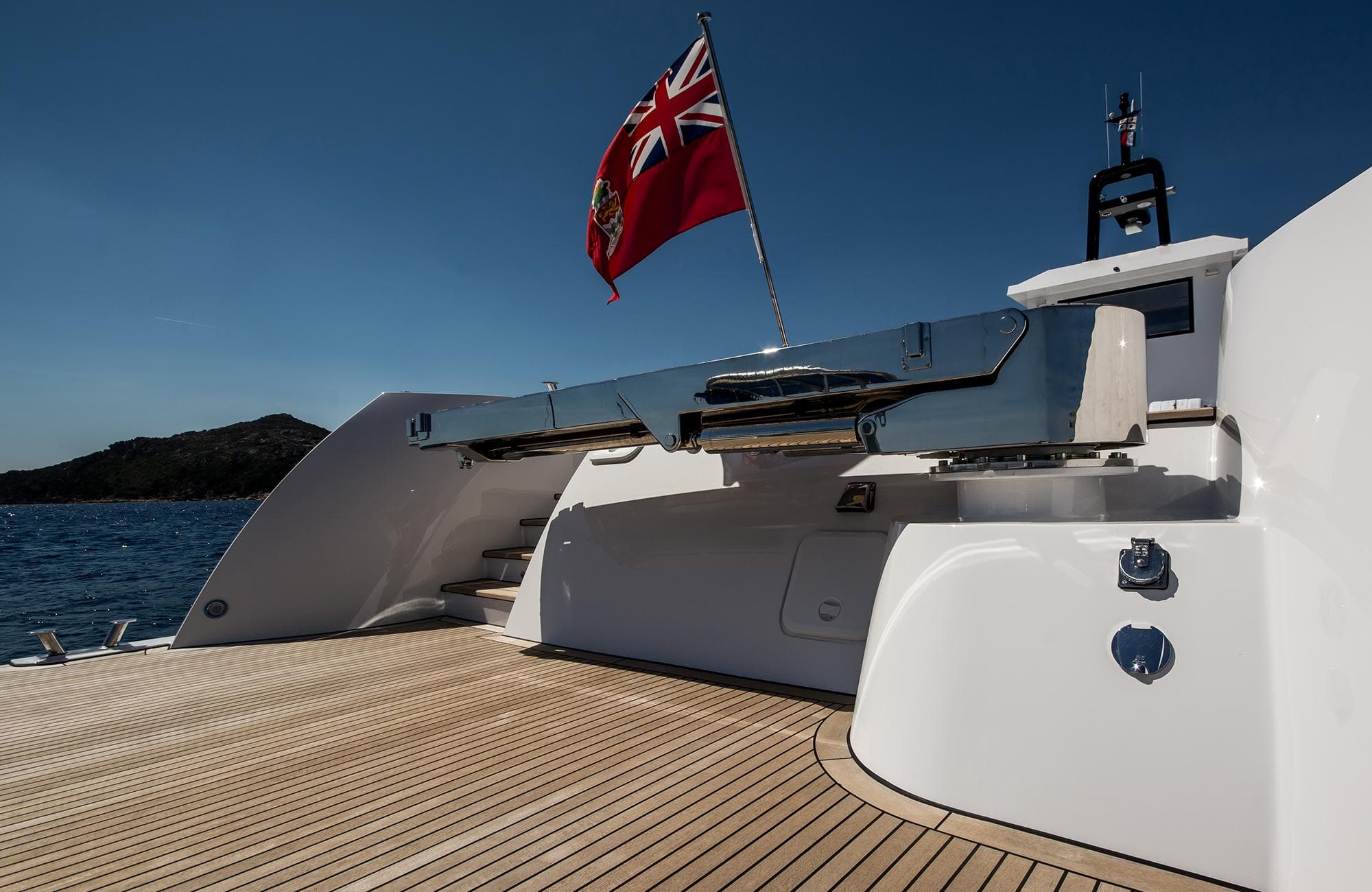Luxurious 2027 Outer Reef Yachts 20 YXT with sleek deck and flag, cruising on open water.