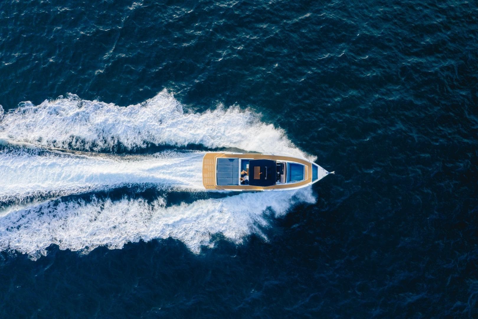 Aerial view of 2026 De Antonio Yachts 50 Open cruising on open water.
