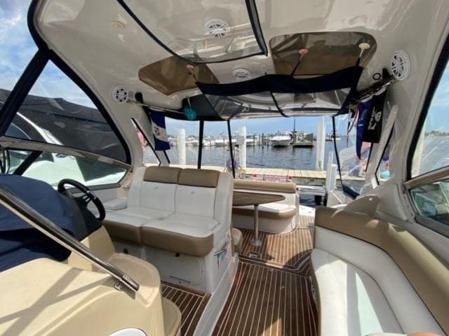Interior of 2014 Four Winns 355V boat with dock and water view.