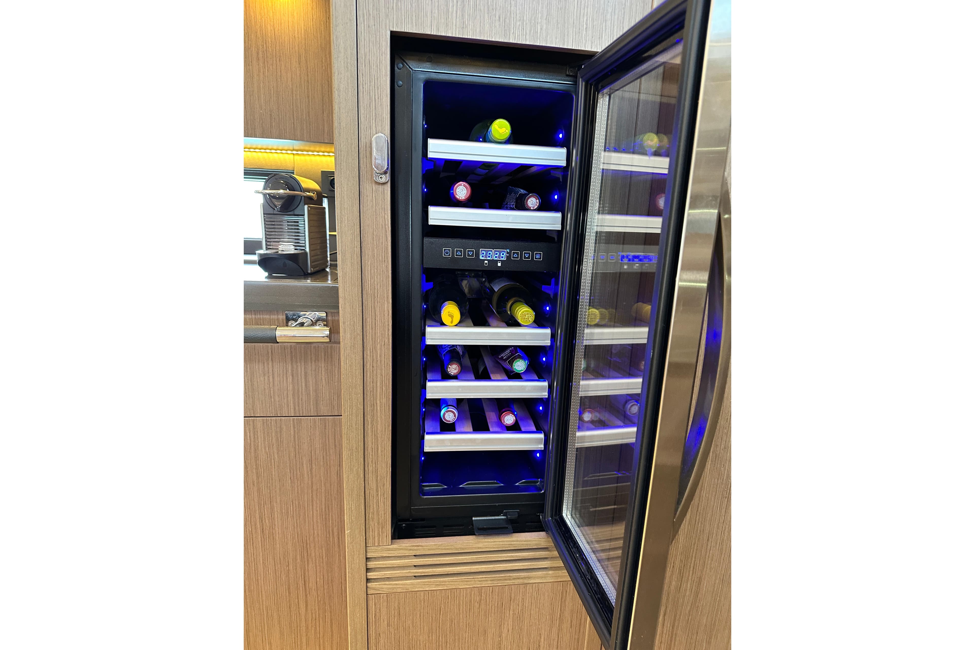 Wine cooler in 2019 Beneteau Oceanis Yacht 62, showcasing luxury interior design.