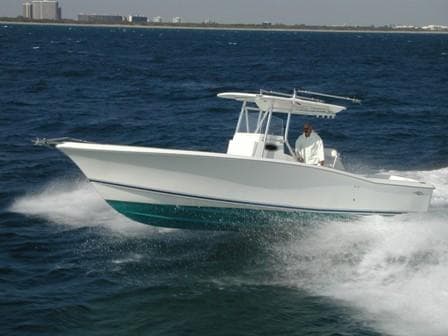 2024 Jersey Cape 31 Little Devil boat cruising on the ocean.