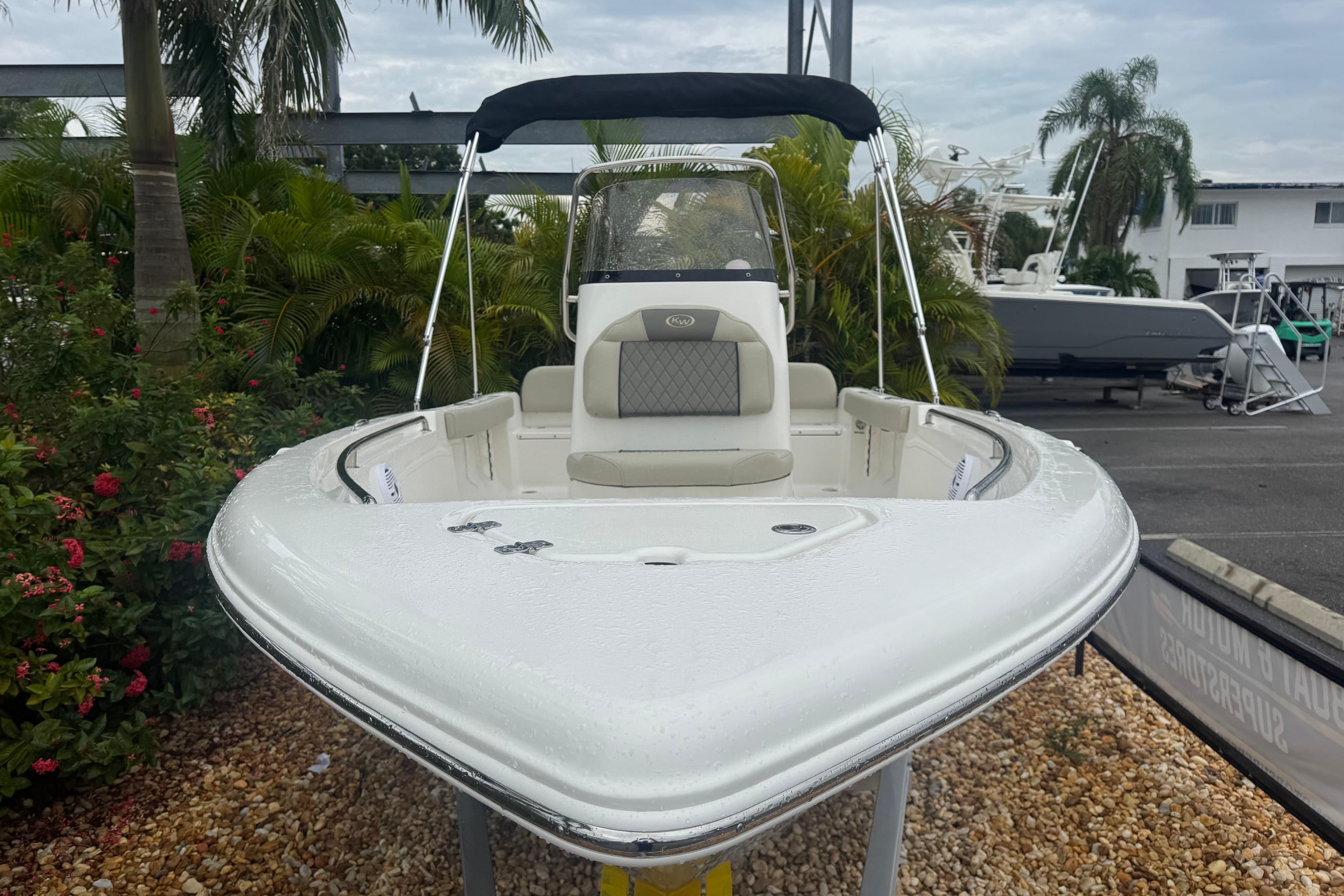 2026 Key West 189 FS boat displayed outdoors with lush greenery background.