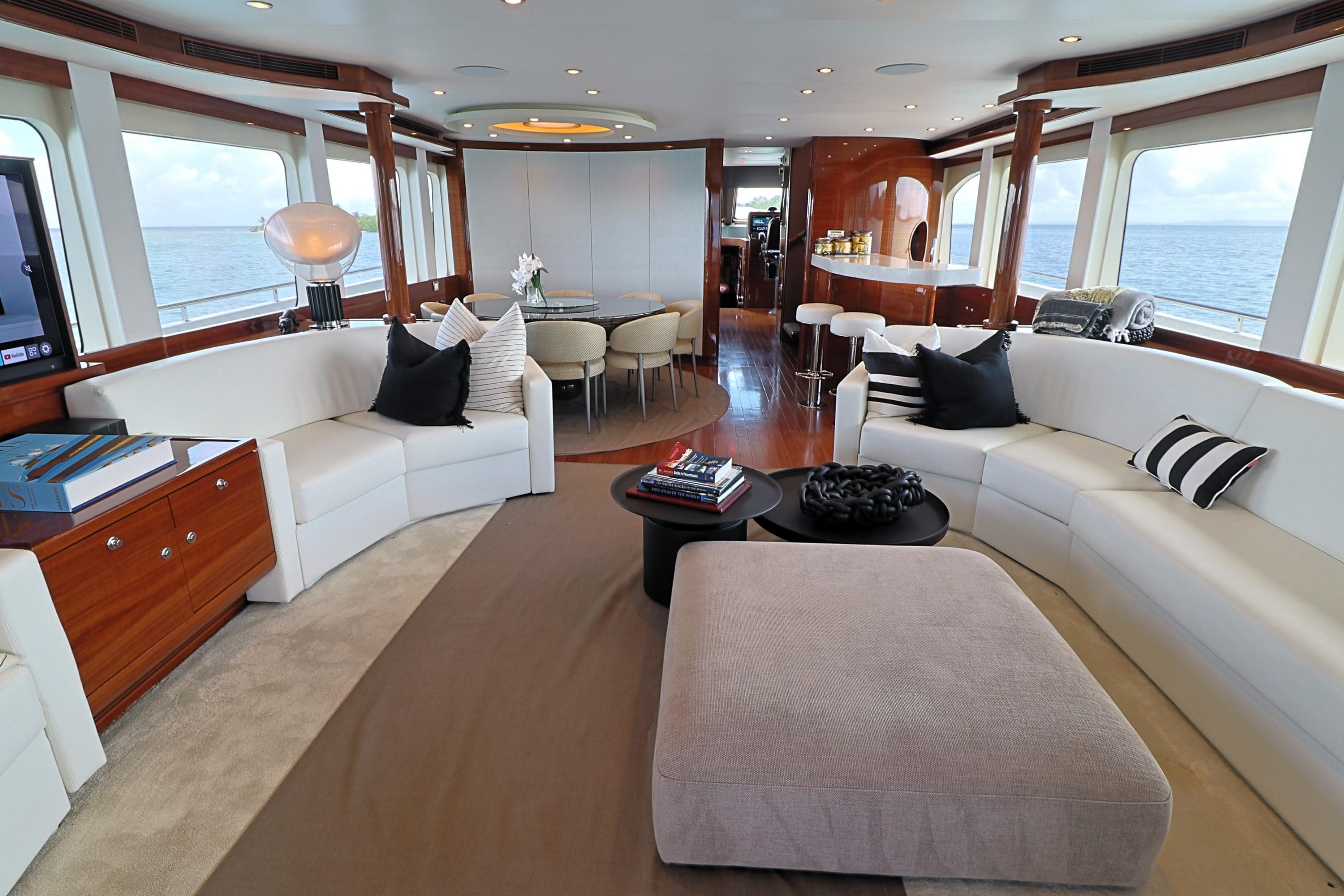 Luxurious interior of 2013 Cheoy Lee Bravo yacht with elegant seating and ocean views.