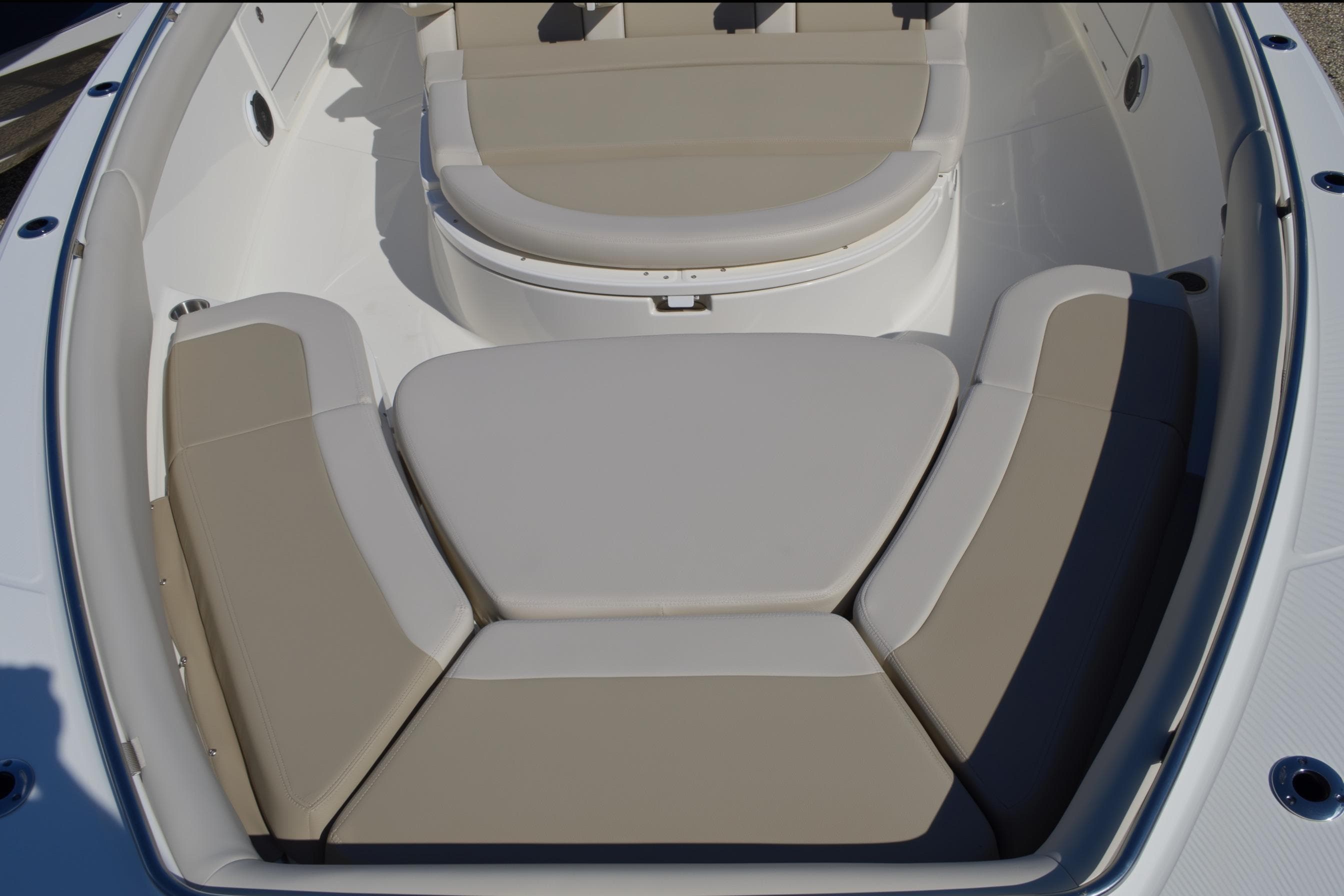 2018 Boston Whaler 420 Outrage boat with beige cushioned seating area.