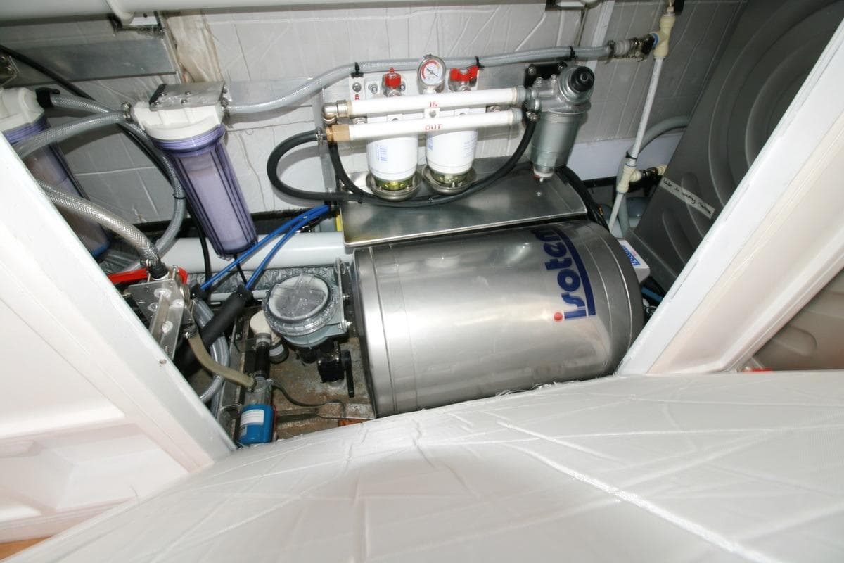 Engine room of 2022 Custom Southwell 51 yacht with Isotemp water heater and filtration system.