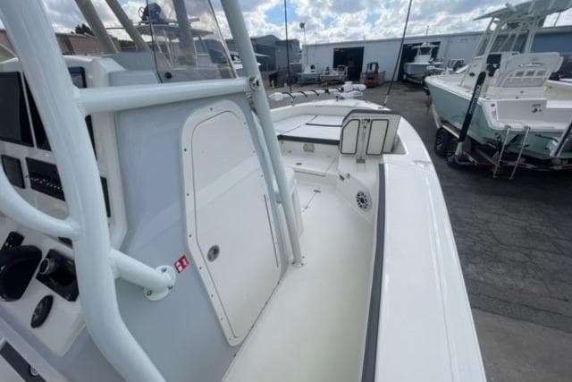 2026 Pathfinder 2600 TRS boat interior with console and seating, docked outdoors.