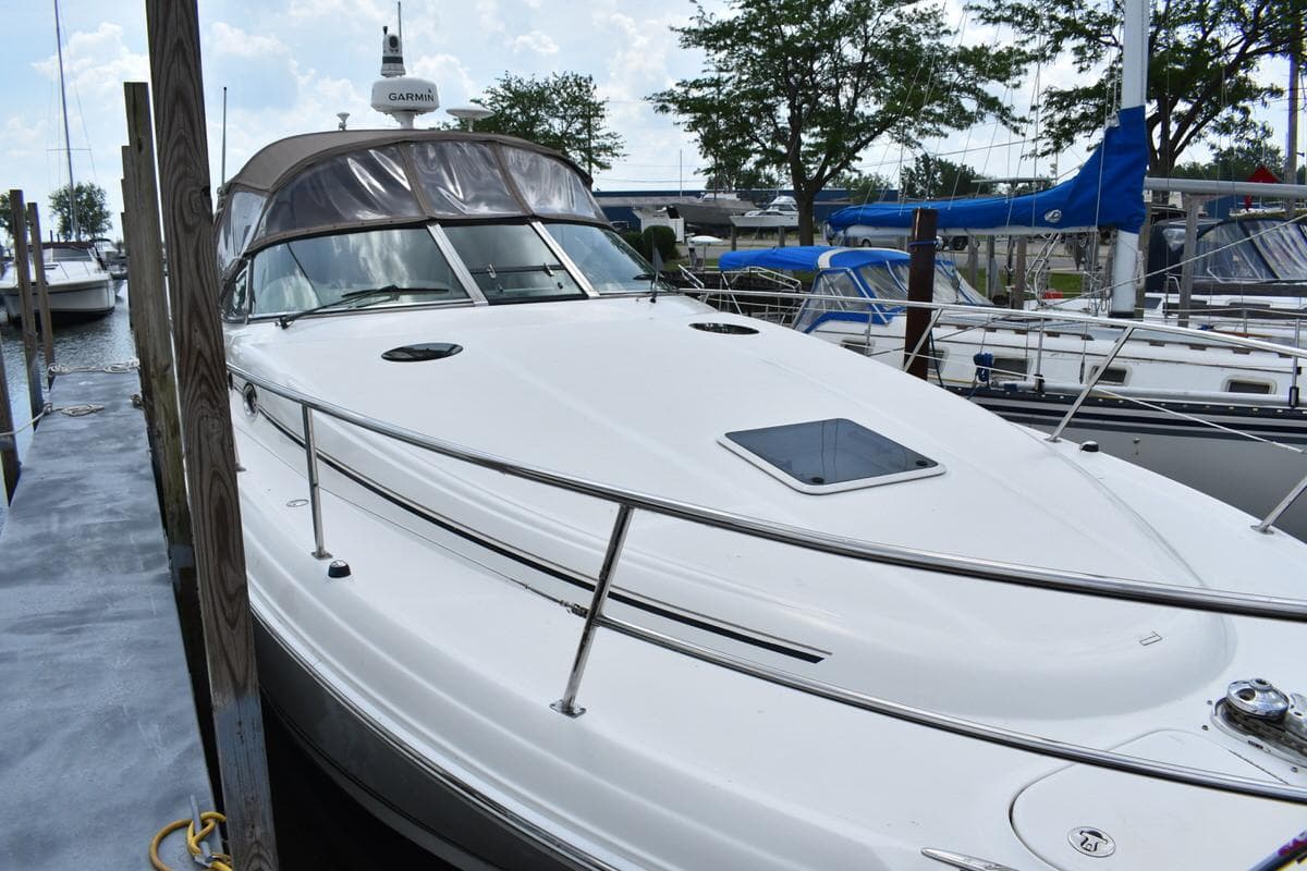 2003 Sea Ray 360 Sundancer docked at marina, featuring sleek design and spacious deck.
