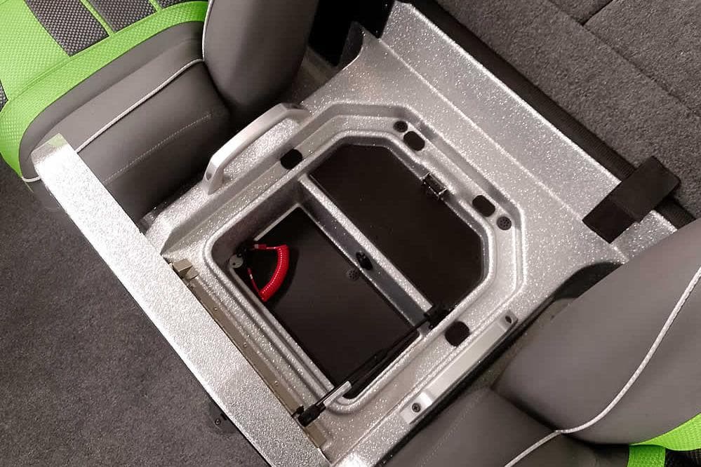 2026 Ranger Z521 boat seat storage compartment with green and gray upholstery.