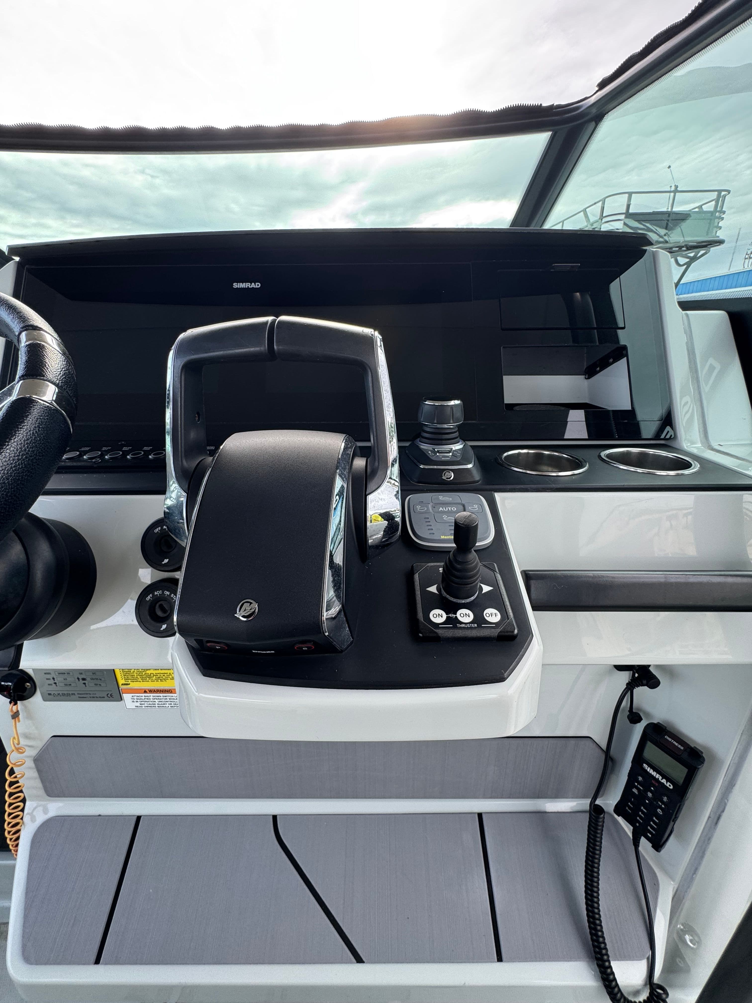 2024 Saxdor 320 GTO helm with modern controls and joystick.