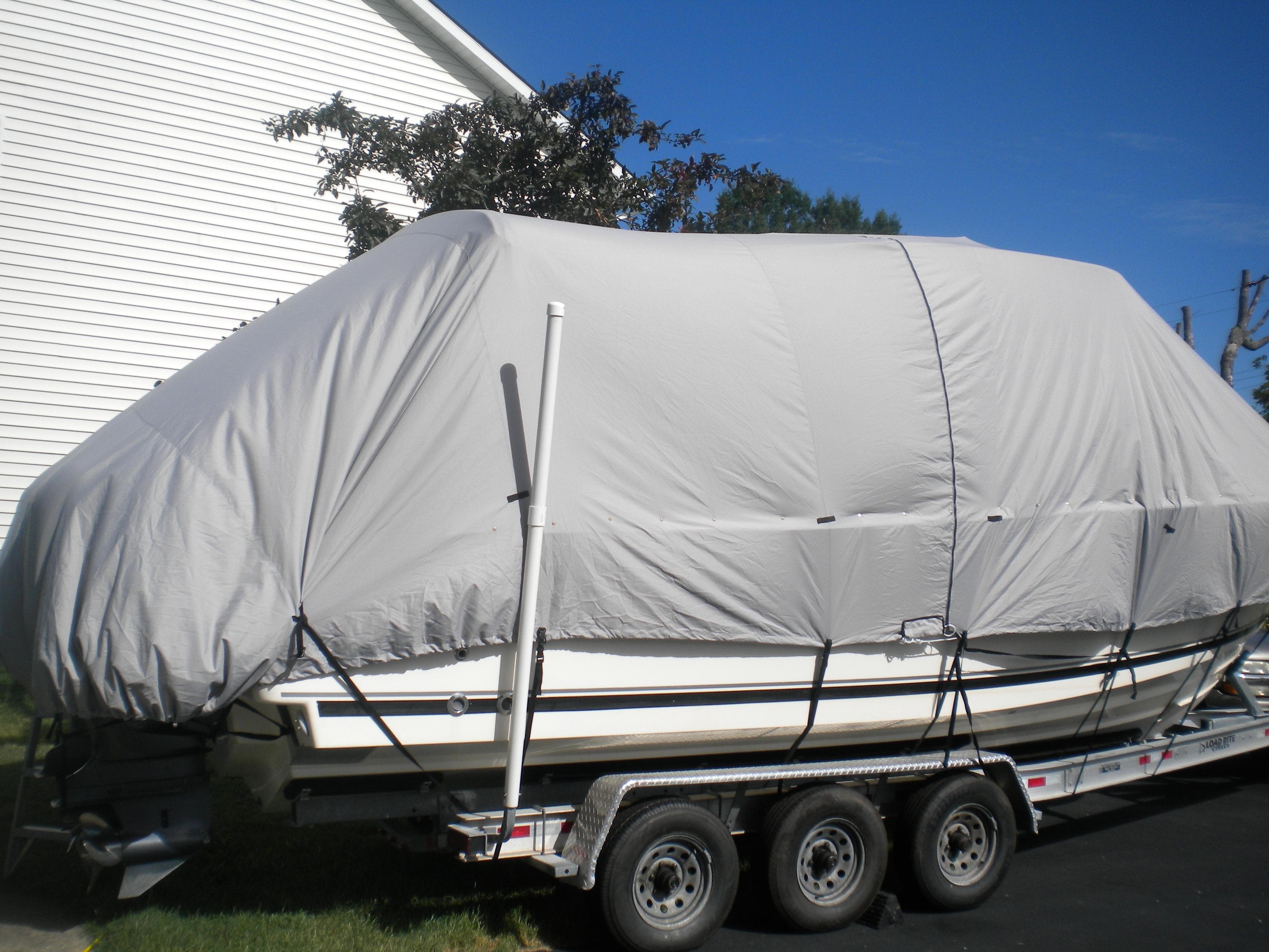 2013 Pursuit S 280 Sport boat covered on trailer.