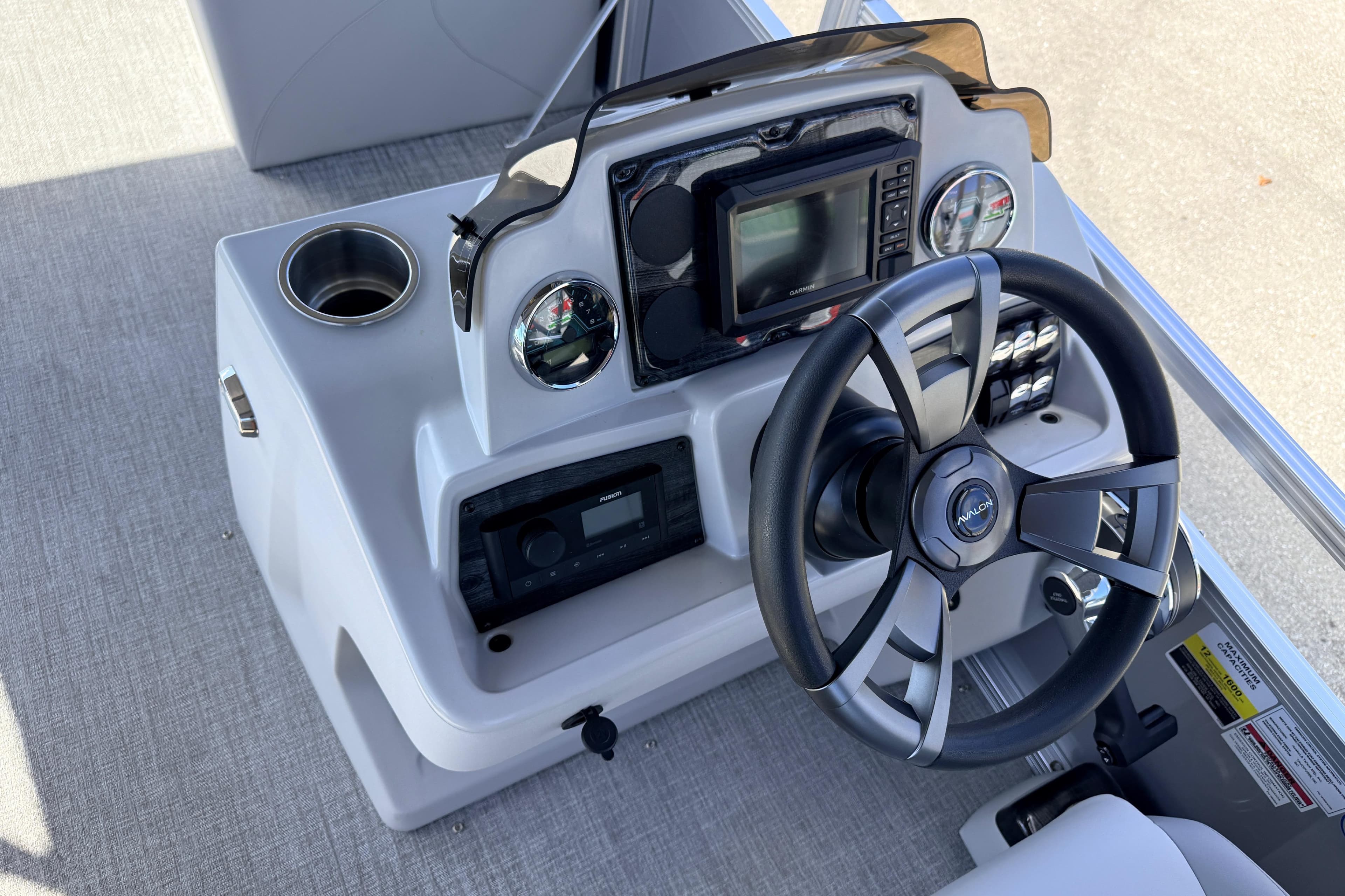 Steering console of 2026 Avalon 2385 Venture 85 Rear Fish Tri Toon boat.