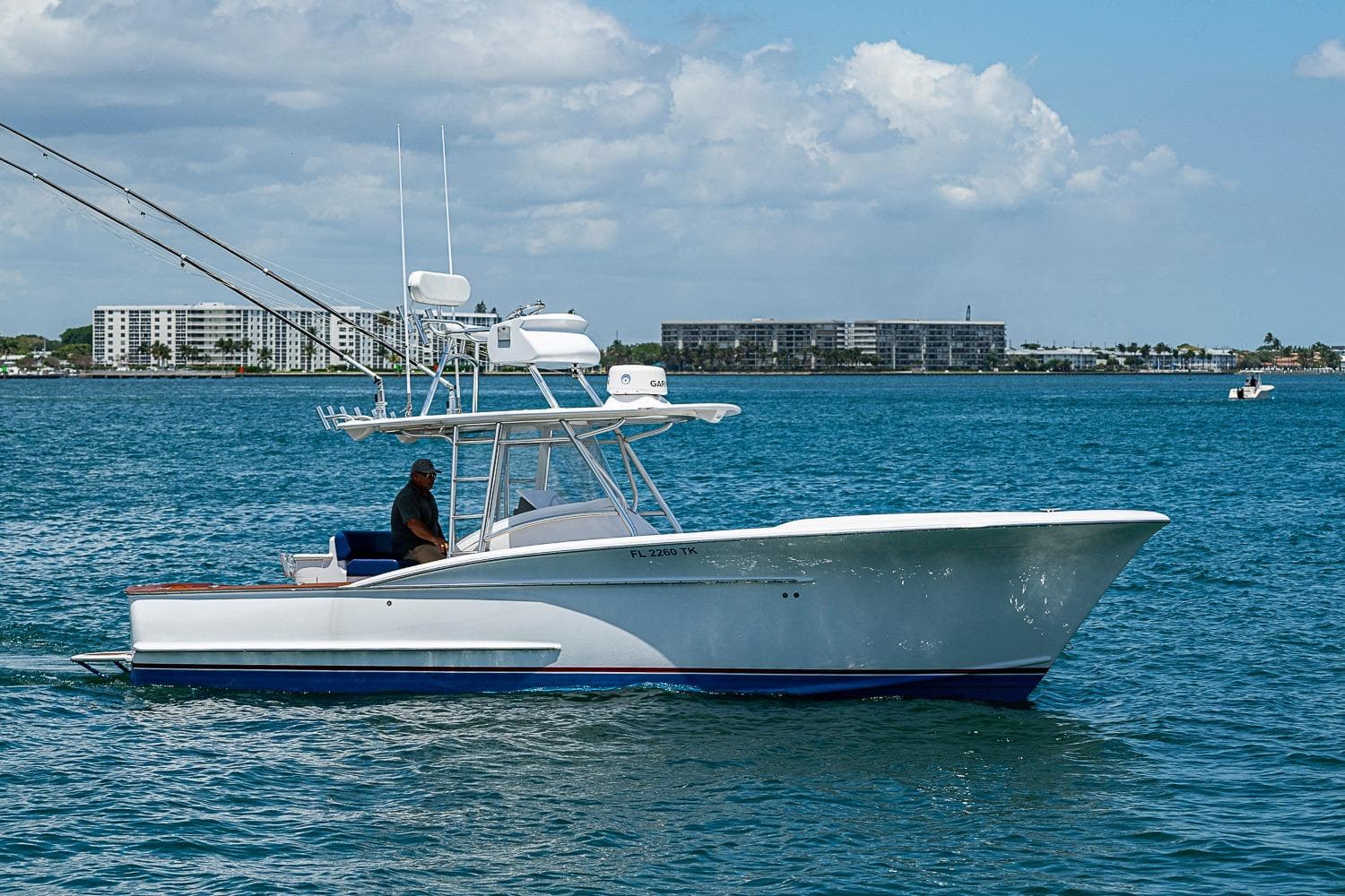 2010 Winter Custom Yachts Center Console boat cruising on blue ocean waters.