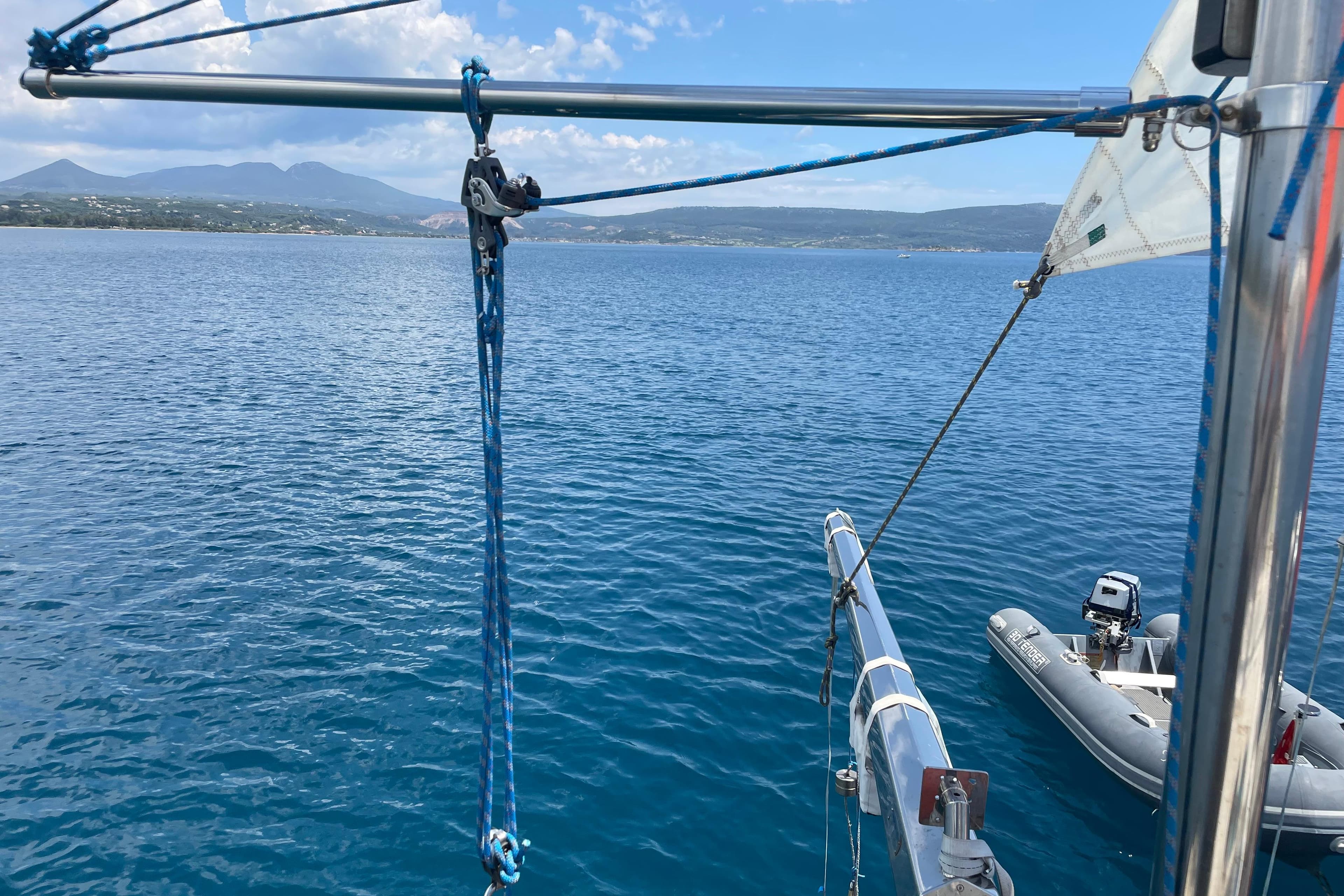 Sailboat view over calm sea with distant mountains, featuring Moody 56, 2004 model.