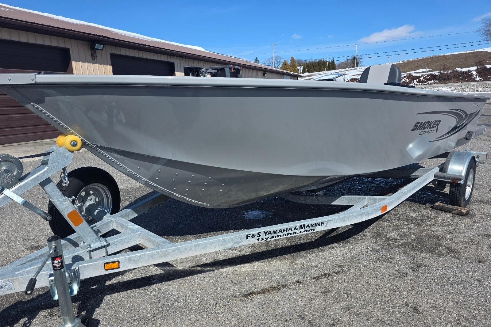 2026 Smoker Craft Freedom 160 TL boat on trailer, parked outdoors.