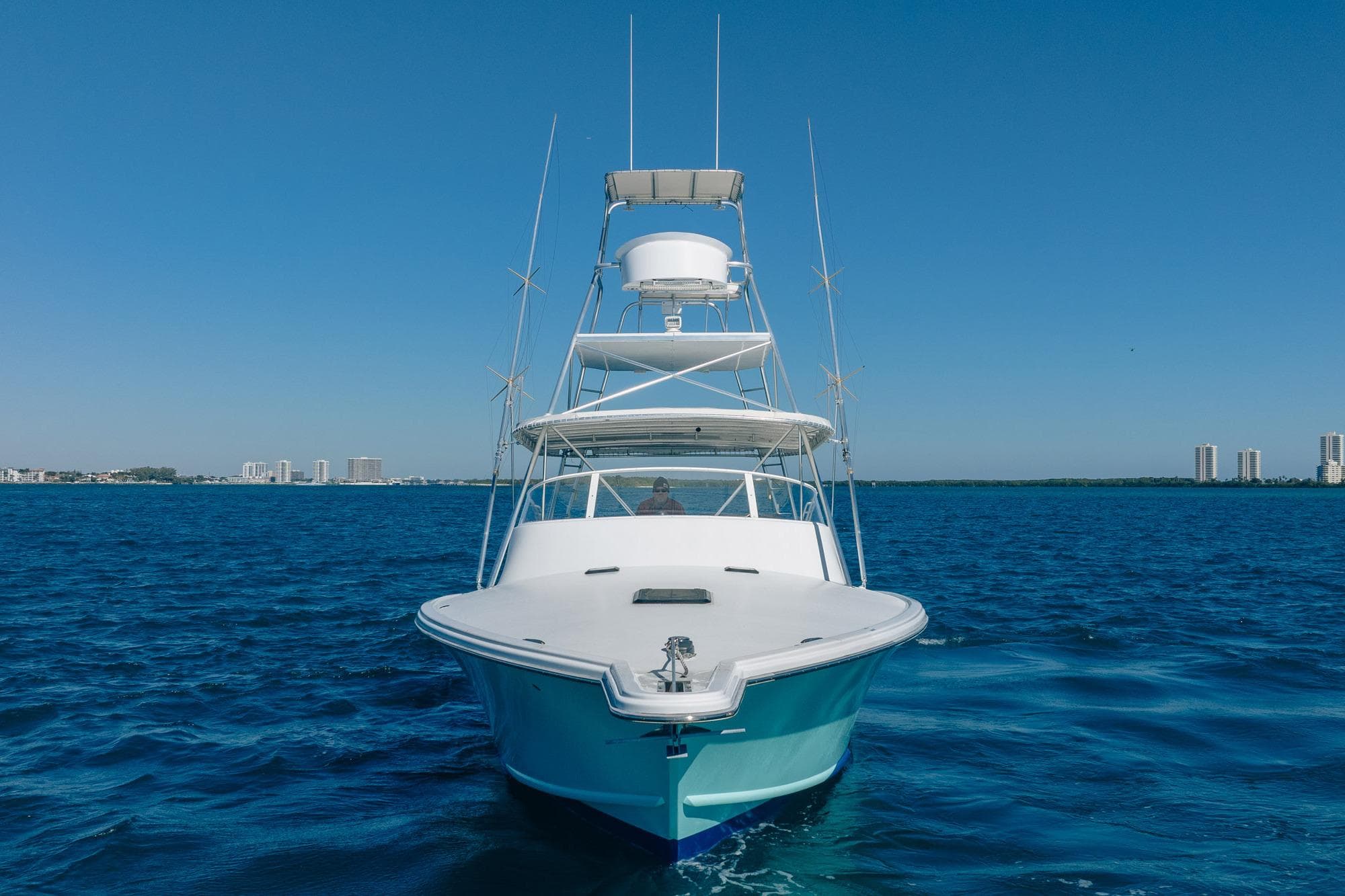 Front view of 1997 Strike 42 Express yacht on open blue water.