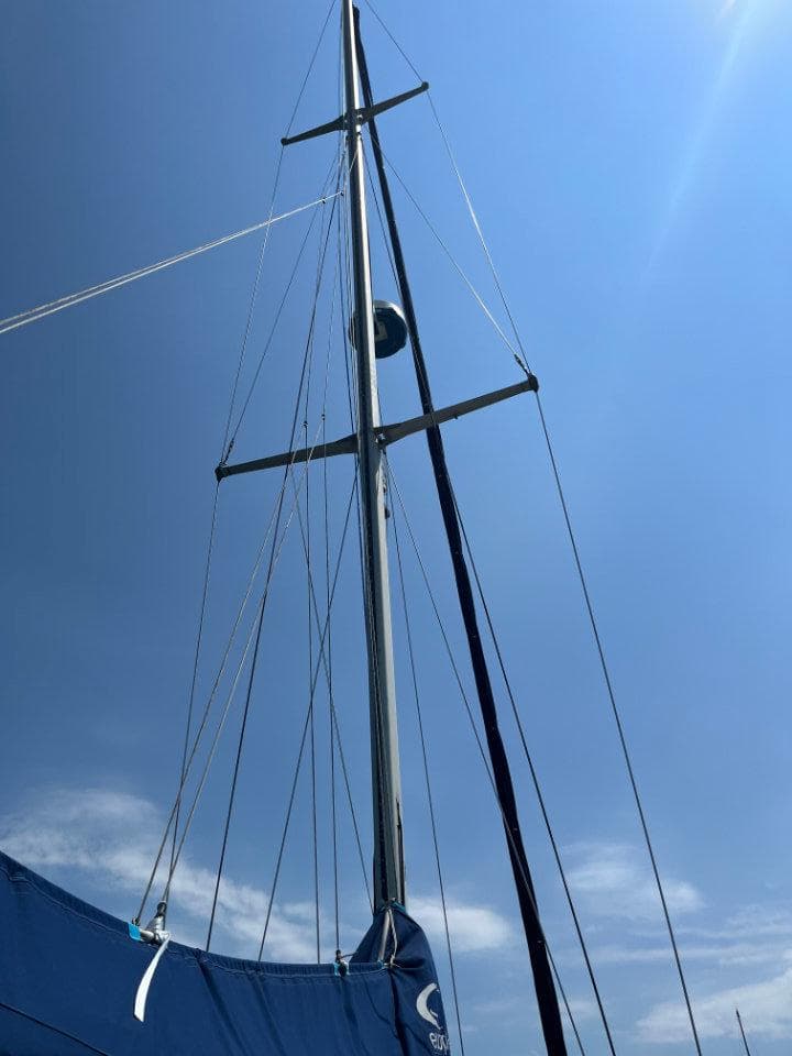 Sailboat mast of 1986 Nautor Swan 43 against a clear blue sky.