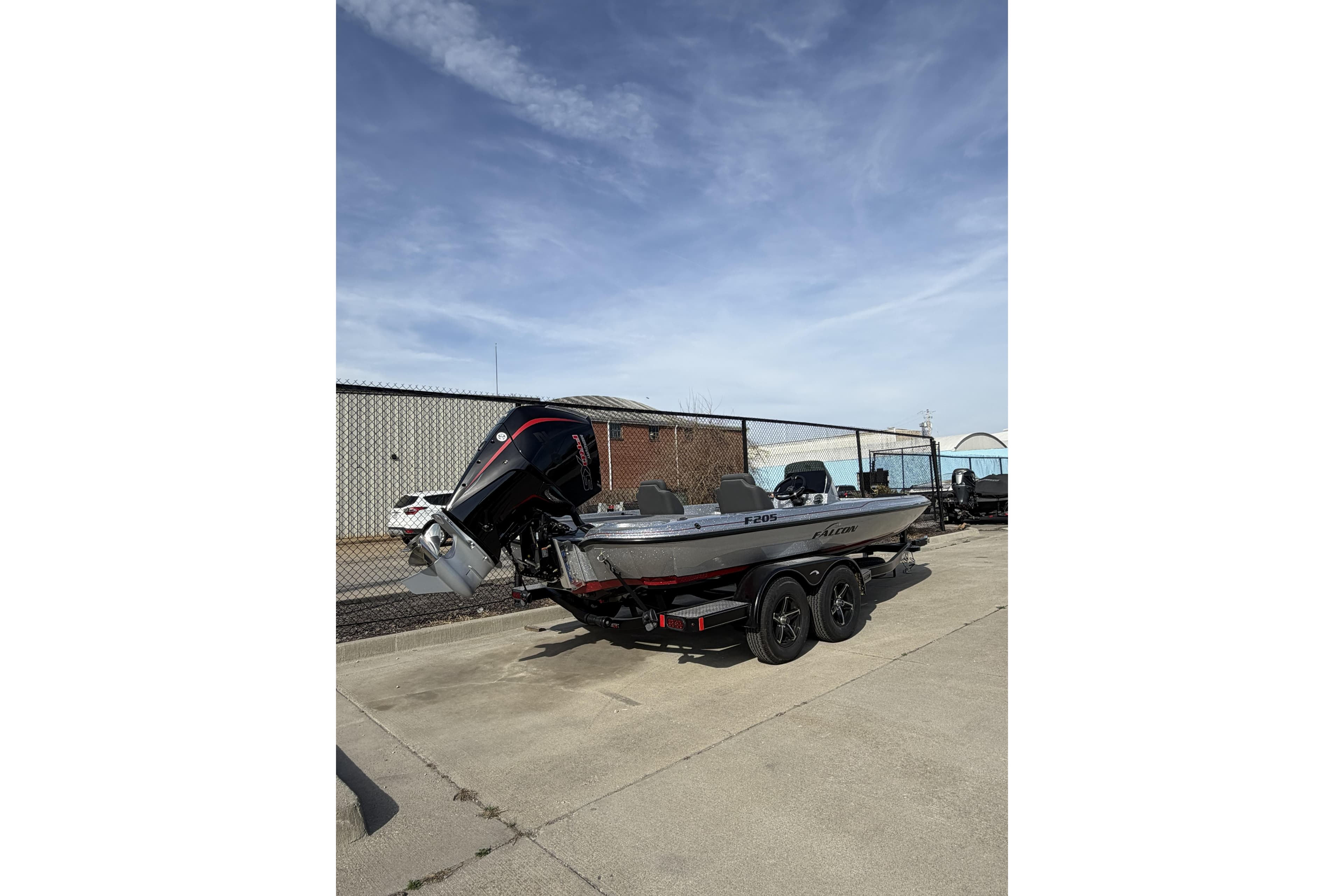2026 Falcon F205 boat on trailer, parked outdoors under a clear sky.