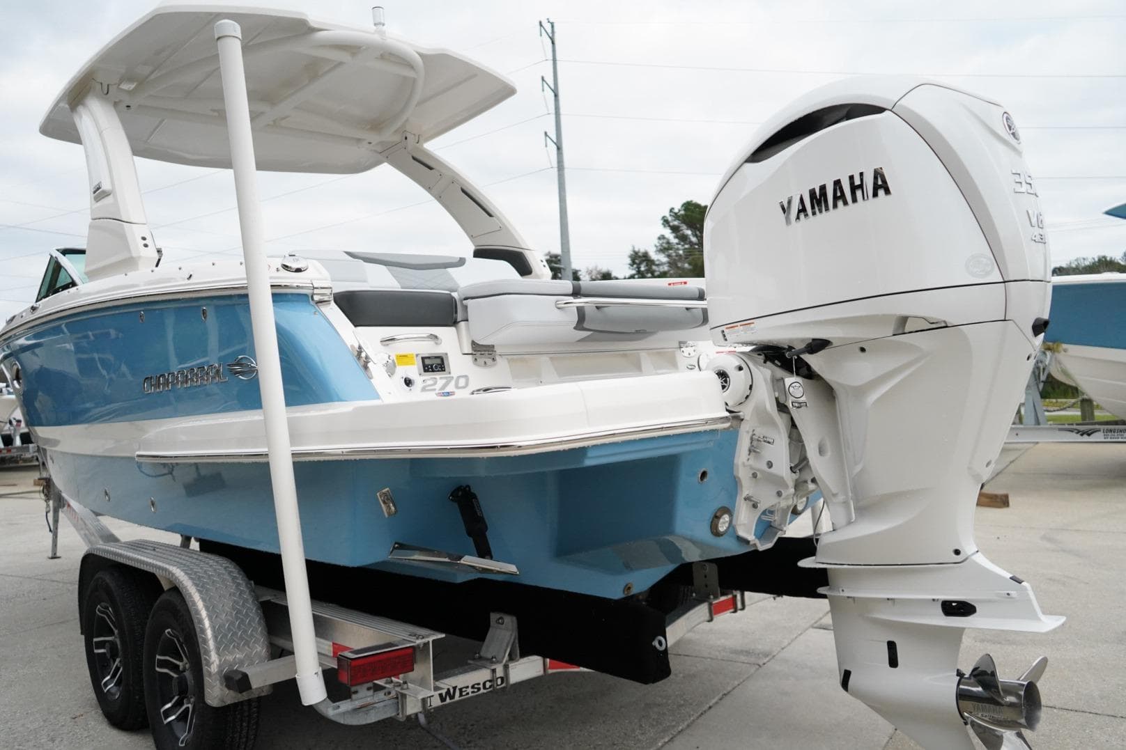 2026 Chaparral 270 OSX boat with Yamaha engine on trailer.
