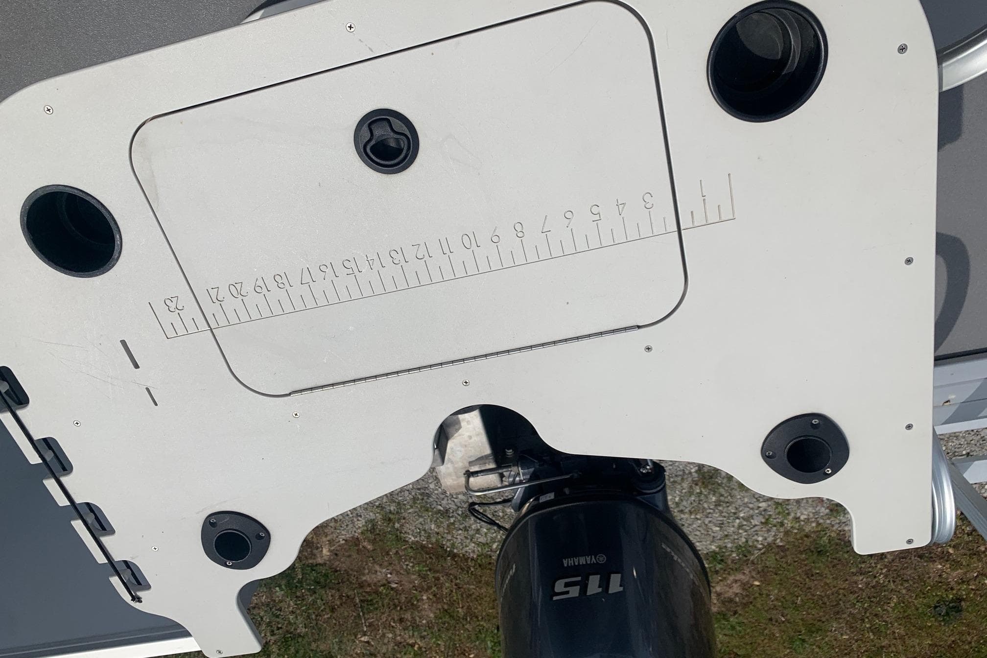Overhead view of a Yamaha G3 V22FC boat motor and measuring board, 2019 model.