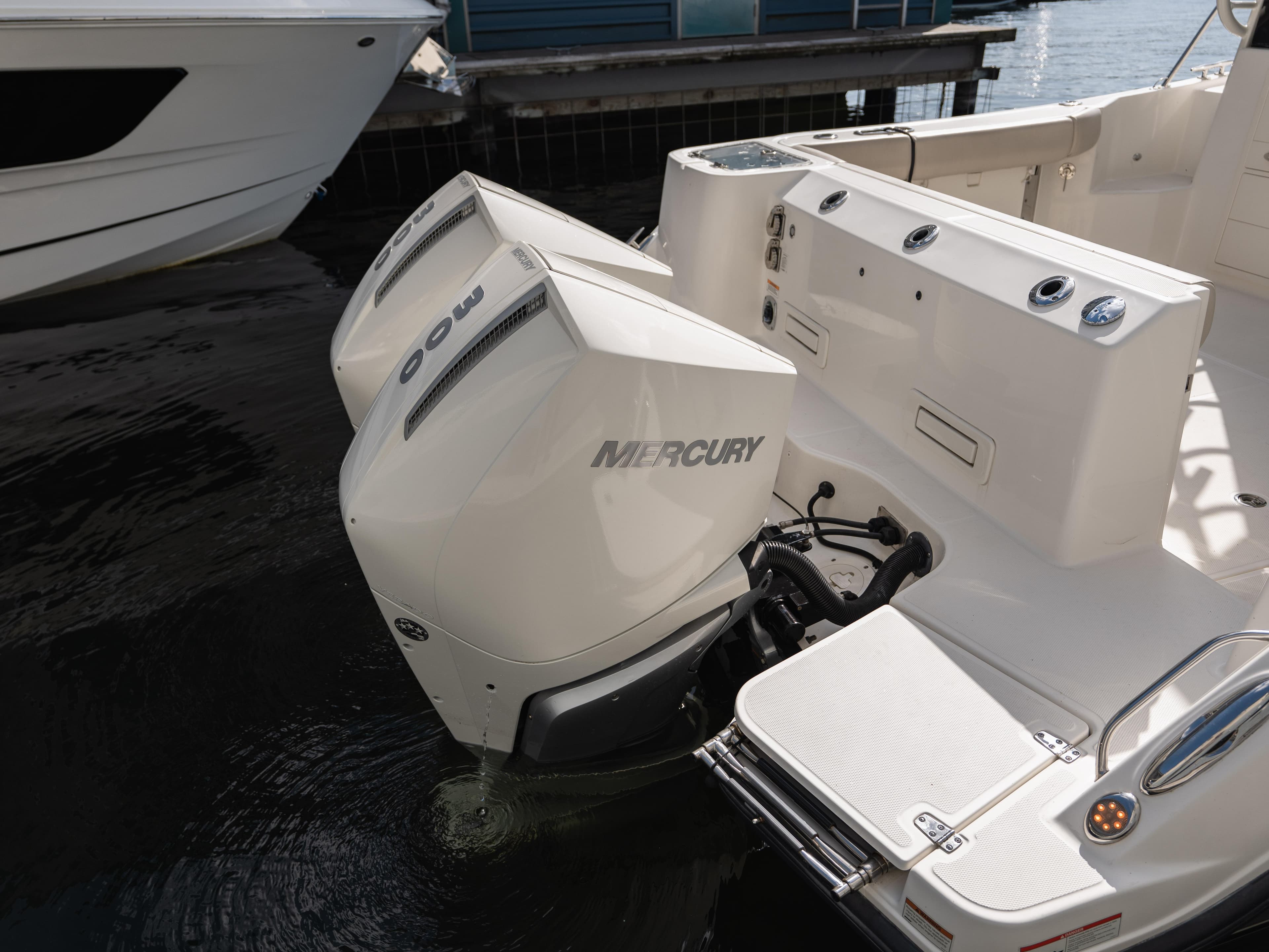 2020 Boston Whaler 325 Conquest Pilothouse with twin Mercury outboard engines.