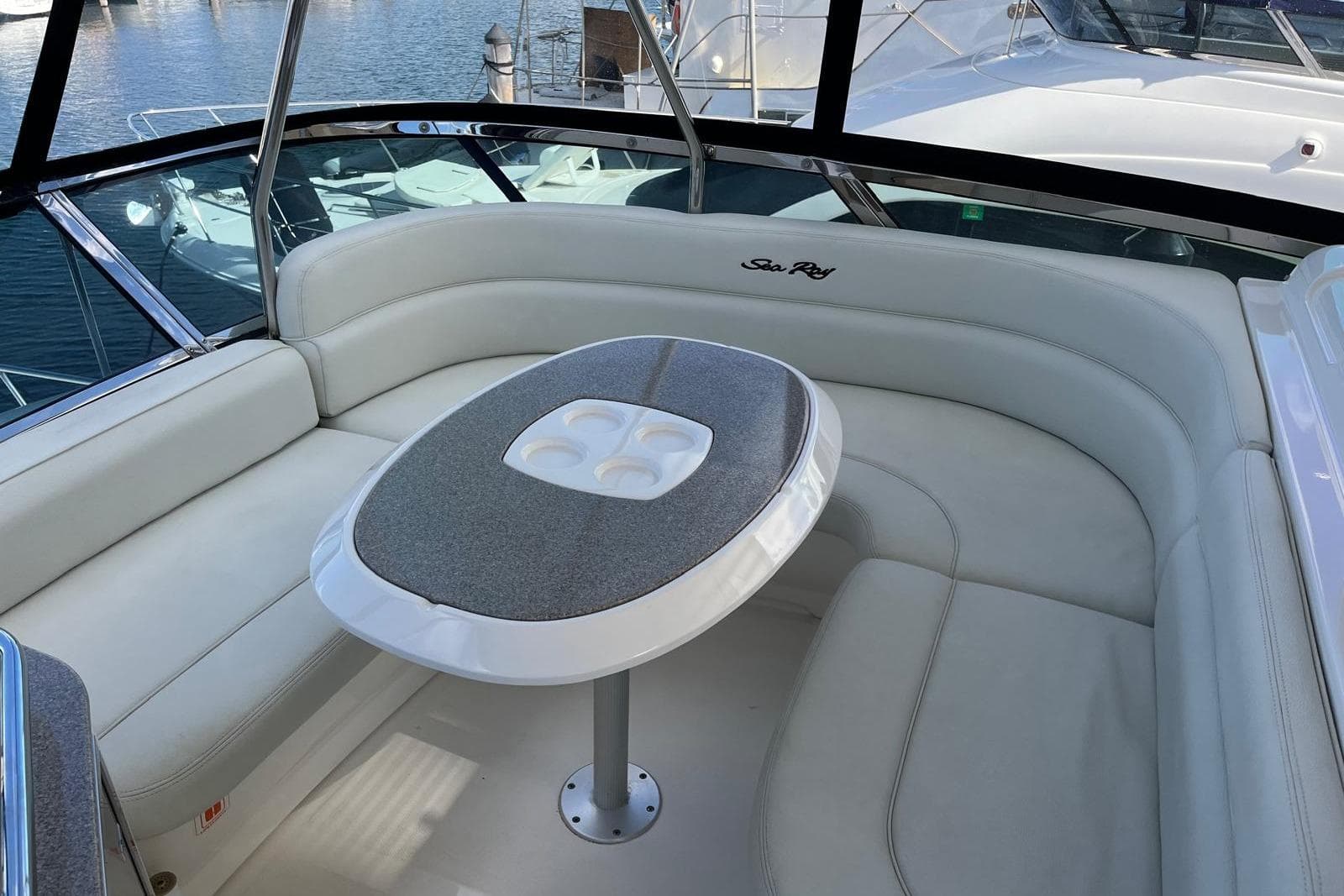 Luxurious seating area on 2006 Sea Ray 52 Sedan Bridge yacht, featuring elegant design.
