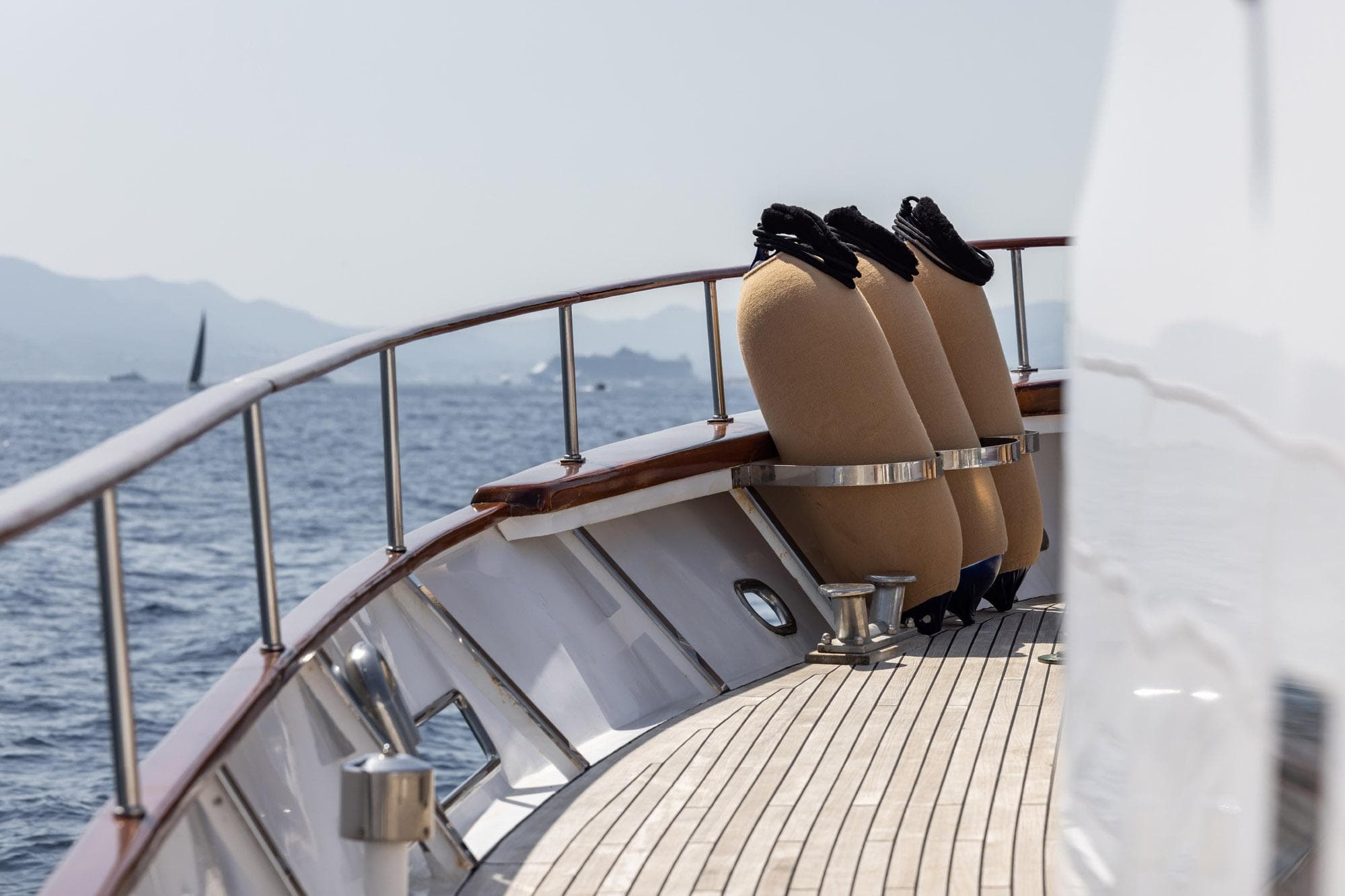 Classic 1963 Feadship Canoe Stern yacht deck with ocean view.