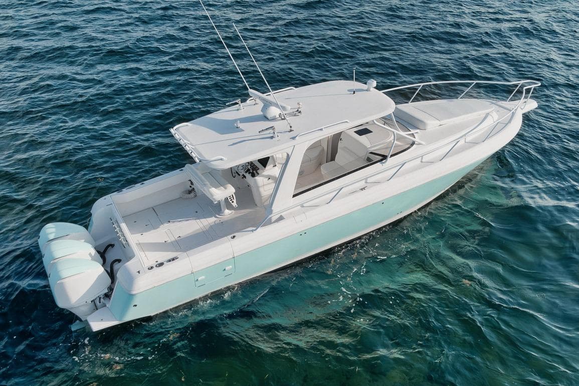 2018 Intrepid 390 Sport Yacht cruising on clear blue water.