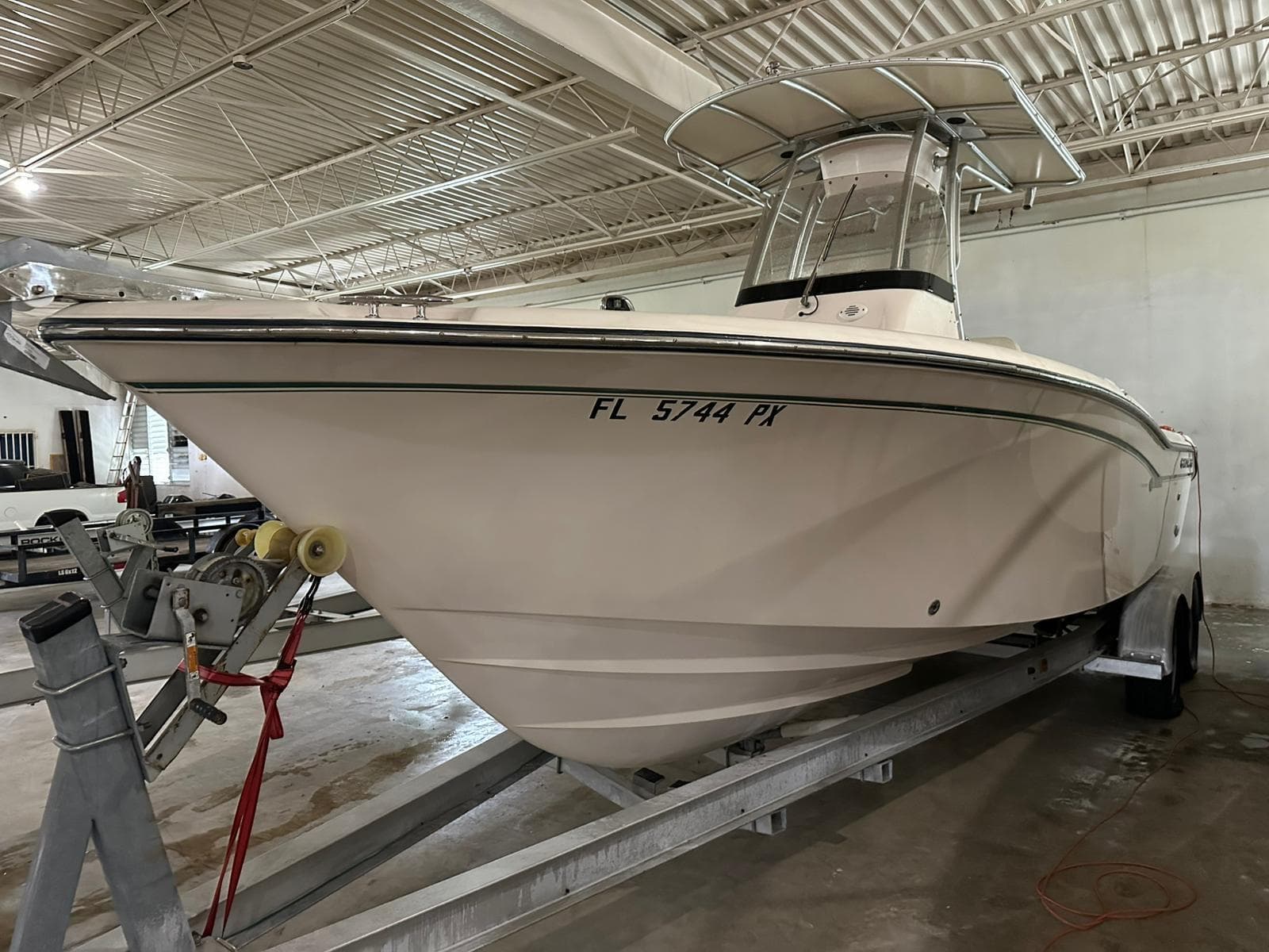 2014 Grady-White Fisherman 257 boat on trailer in indoor storage.