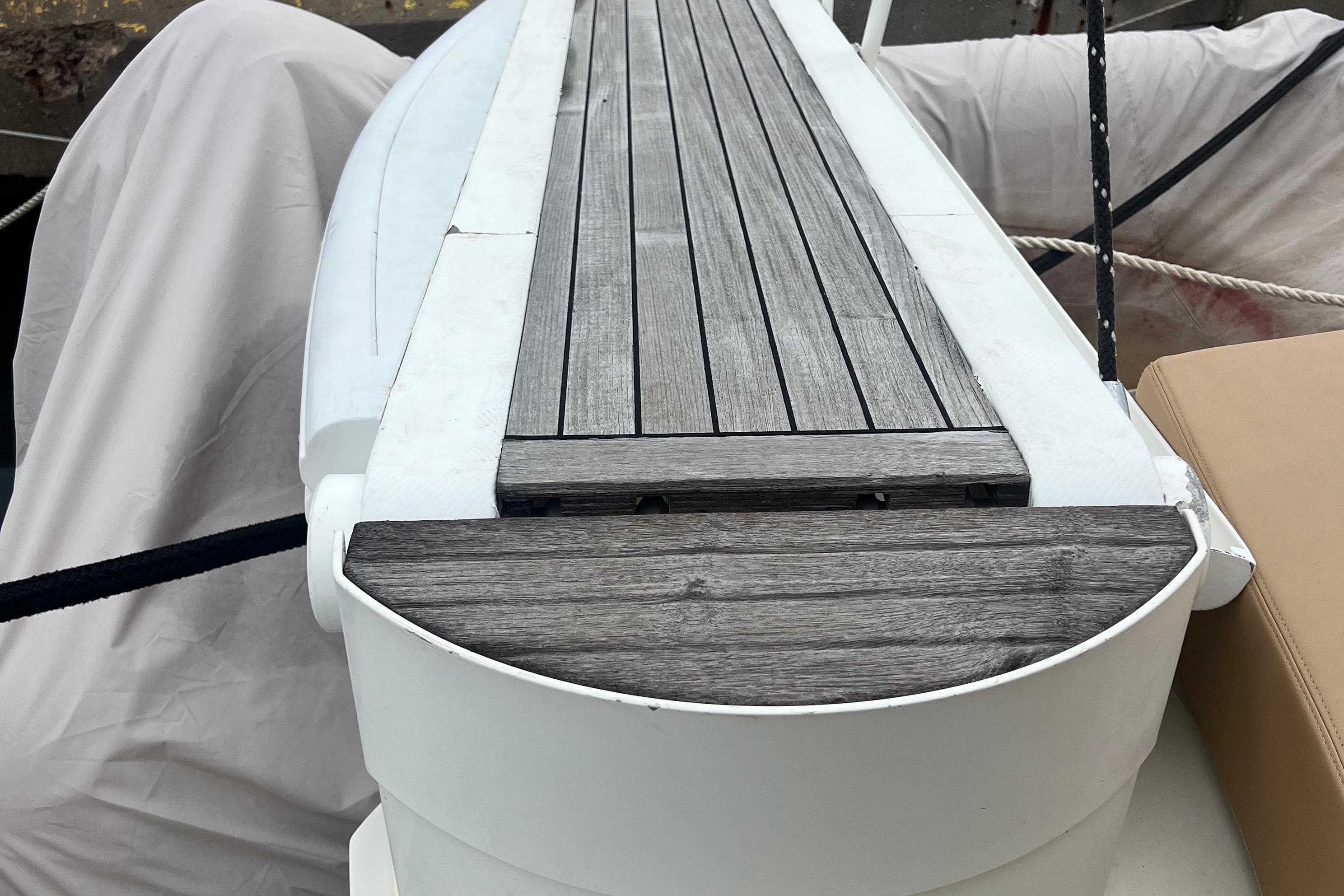 Teak deck of 2002 Sunseeker Manhattan 64 yacht, featuring sleek design and craftsmanship.