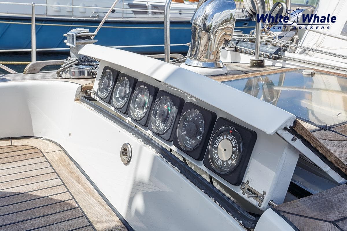 Control panel of 1989 Dubbel & Jesse Nordsee 55 yacht with gauges and compass.