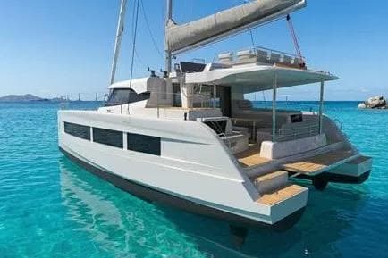 2026 Aventura Yachts 43 catamaran sailing in clear turquoise waters.