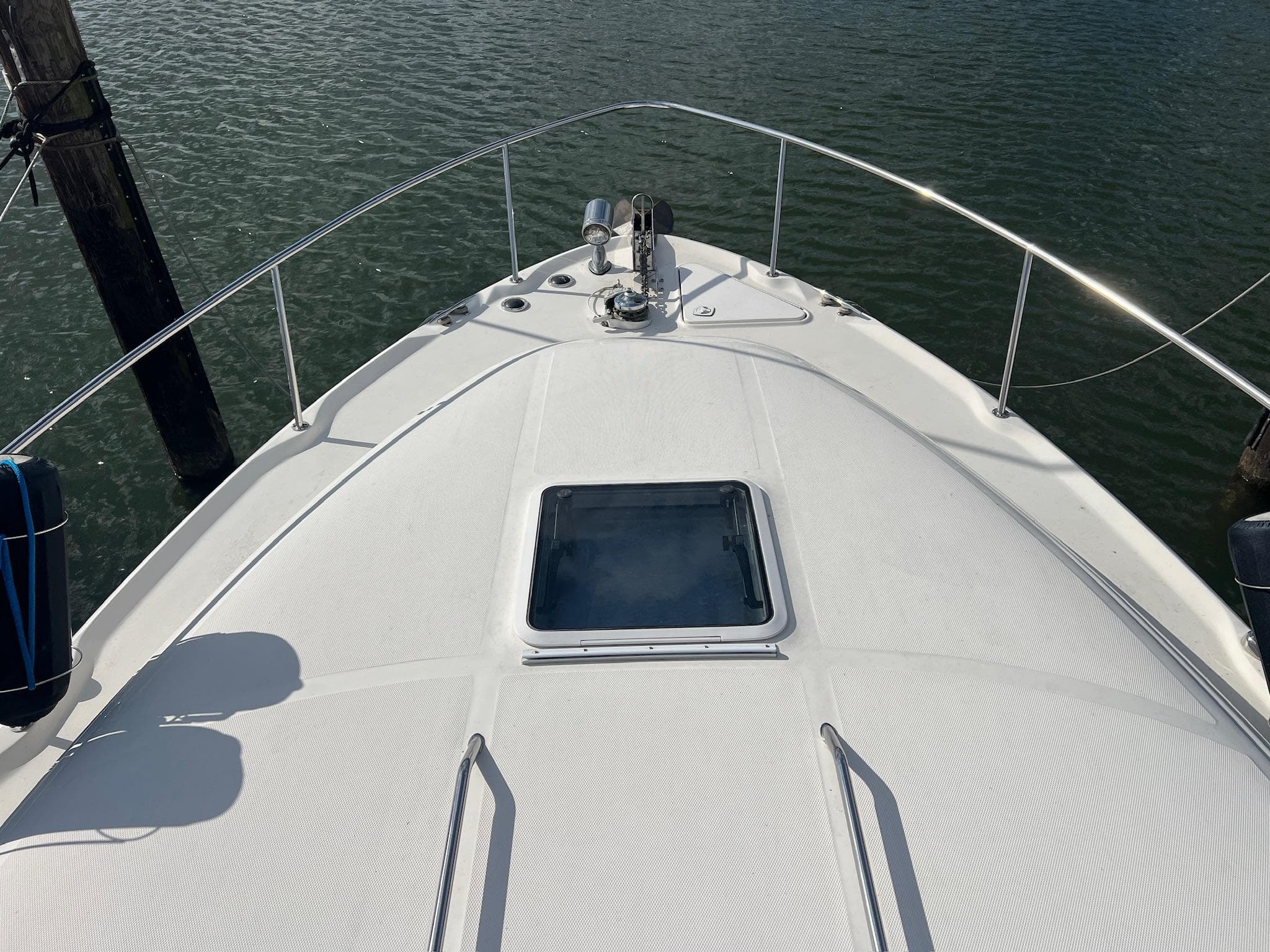 Bow view of 2001 Sea Ray 340 Sundancer yacht on water.