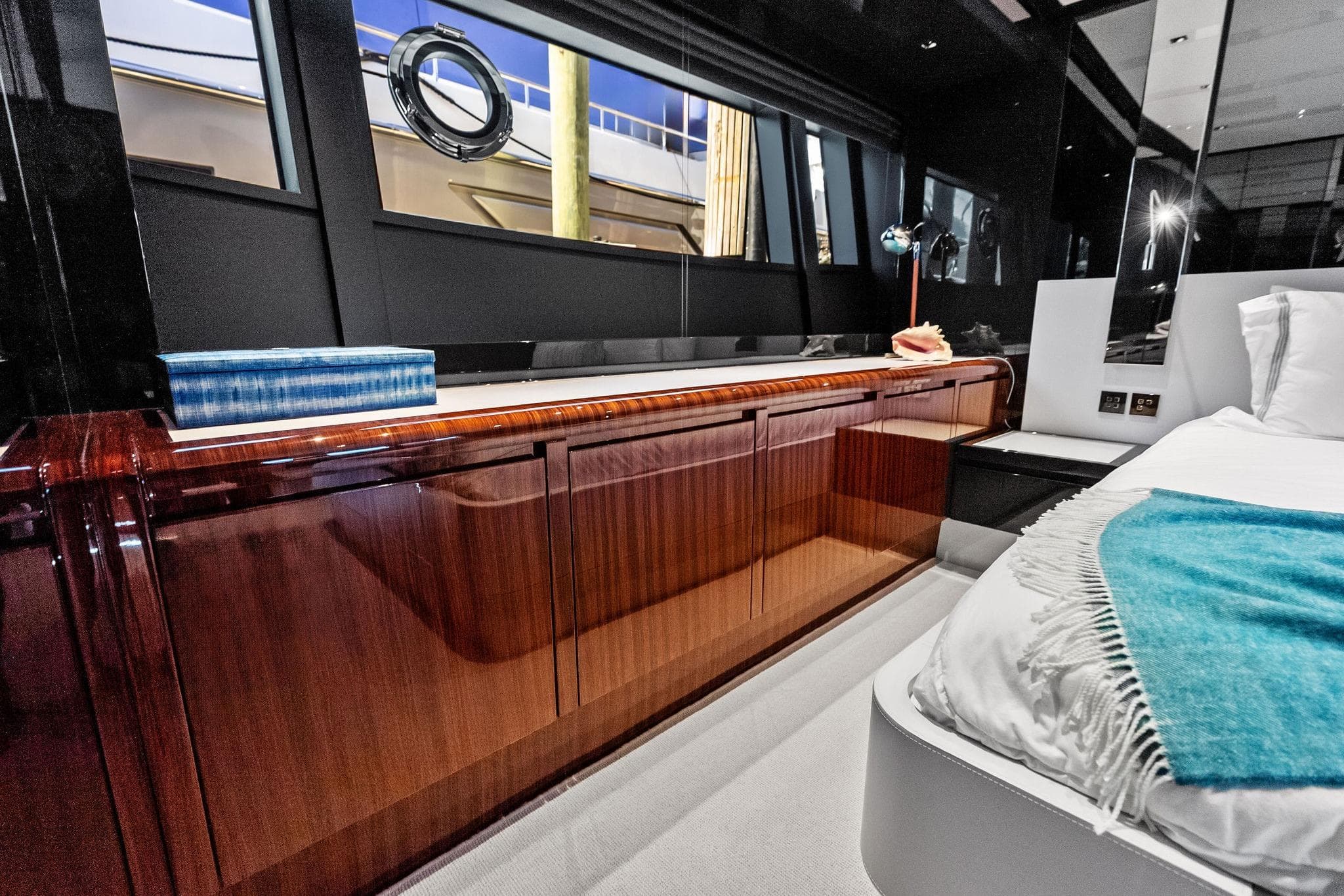Luxurious interior of 2024 Riva 76 PERSEO Super yacht with elegant wood cabinetry.